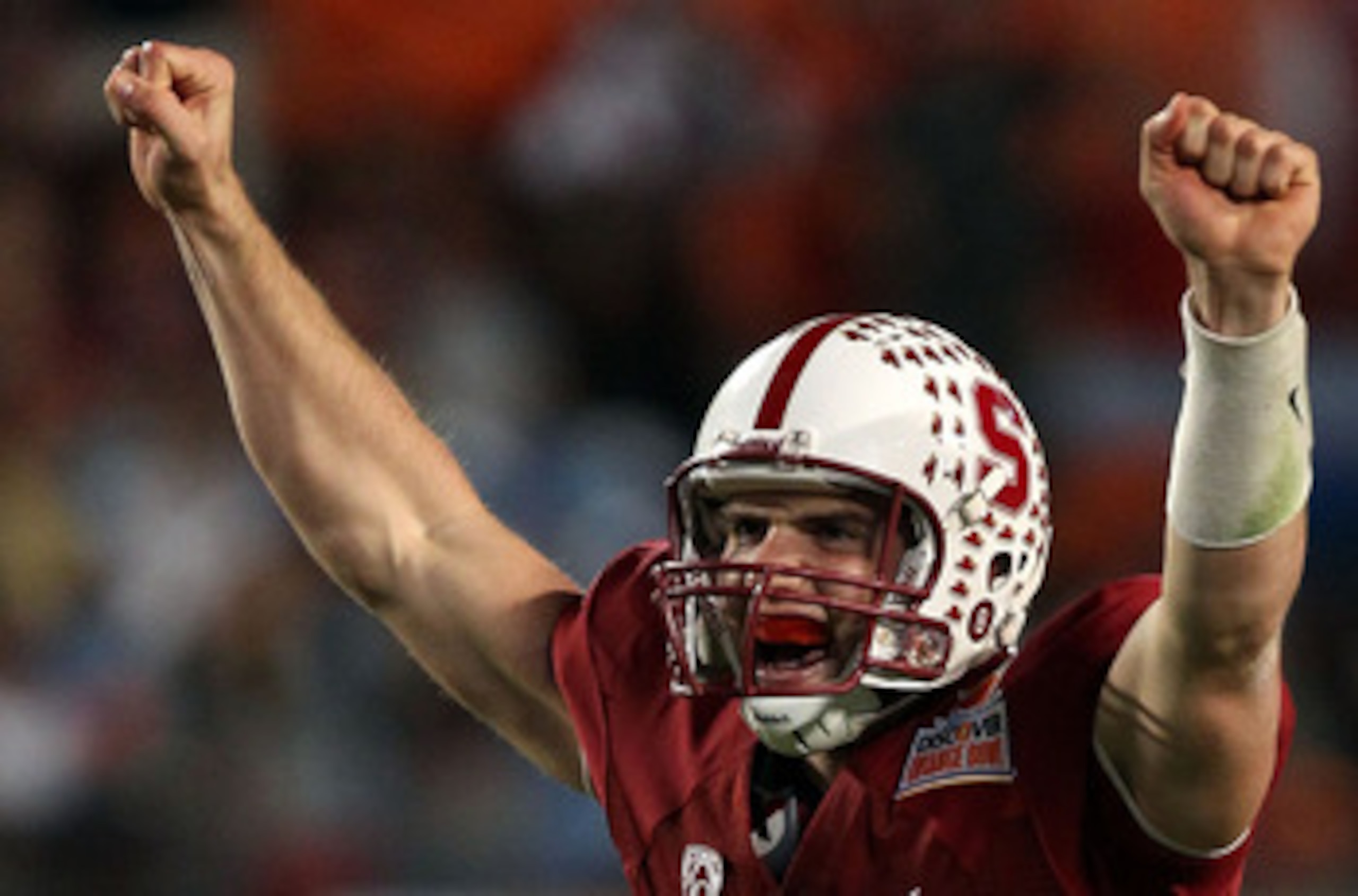 MIAMI, FL - JANUARY 03:  Andrew Luck #12 of the Stanford Cardinal celebrates after he threw a 38-yard touchdown pass in the fourth quarter against the Virginai Tech Hokies during the 2011 Discover Orange Bowl at Sun Life Stadium on January 3, 2011 in Miam