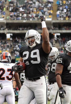 OAKLAND, CA - DECEMBER 19:  Michael Bush #29 of the Oakland Raiders celebrates after he scored a touchdown against the Denver Broncos at Oakland-Alameda County Coliseum on December 19, 2010 in Oakland, California.  (Photo by Ezra Shaw/Getty Images)