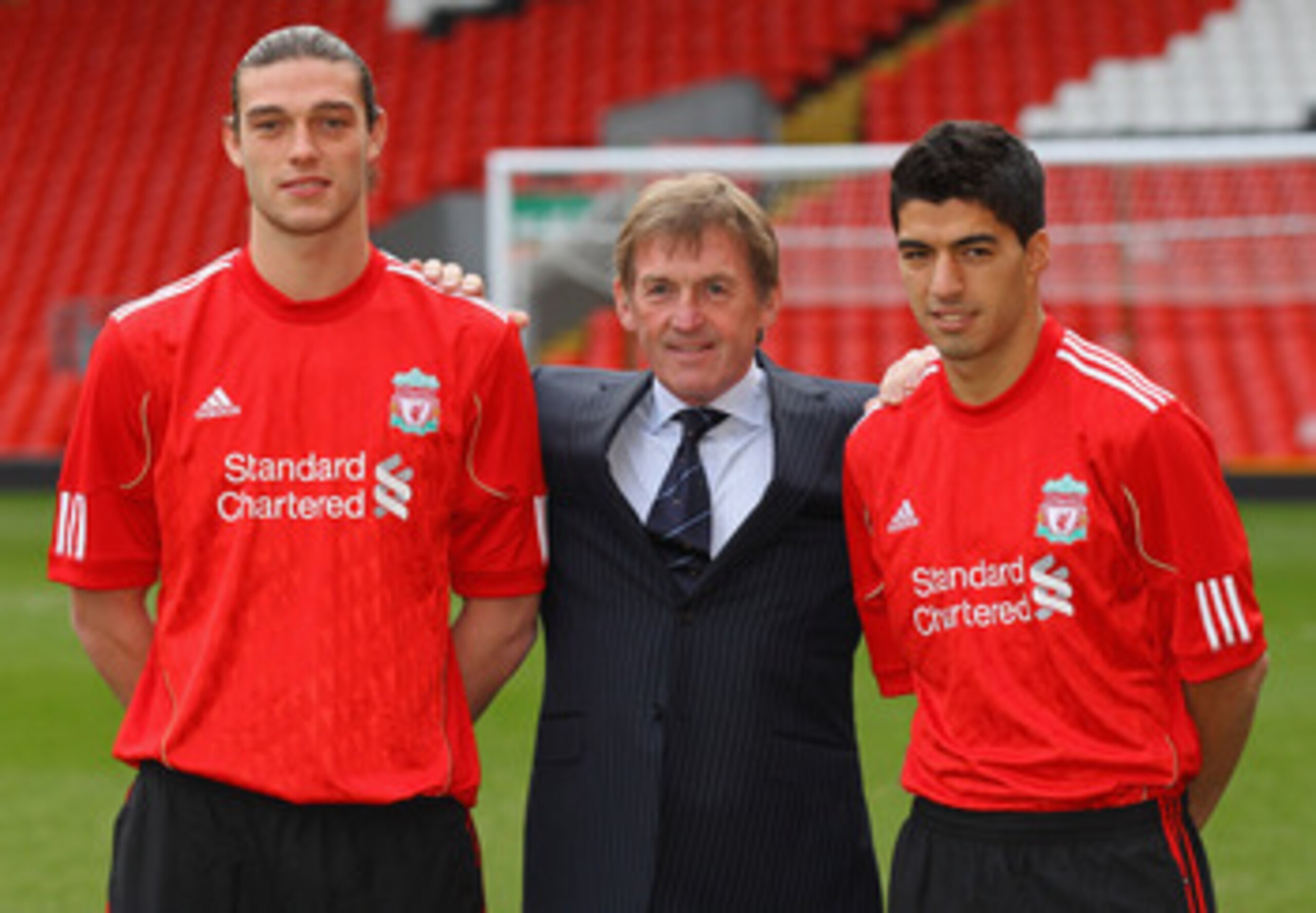 LIVERPOOL, ENGLAND - FEBRUARY 03: Kenny Dalglish the manager of Liverpool stands between his new signings, Andy Carroll (l) and Luis Suarez (r) during a photocall at Anfield on February 3, 2011 in Liverpool, England. (Photo by Alex Livesey/Getty Images) LIVERPOOL, ENGLAND - FEBRUARY 03: Kenny Dalglish the manager of Liverpool stands between his new signings, Andy Carroll (l) and Luis Suarez (r) during a photocall at Anfield on February 3, 2011 in Liverpool, England. (Photo by Alex Livesey/Getty Images)
