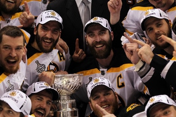 VANCOUVER, BC - JUNE 15:  Patrice Bergeron #37, Andrew Ference #21, Mark Recchi #28, Shawn Thornton #22 and Zdeno Chara #33 of the Boston Bruins pose with the Stanley Cup after defeating the Vancouver Canucks in Game Seven of the 2011 NHL Stanley Cup Fina