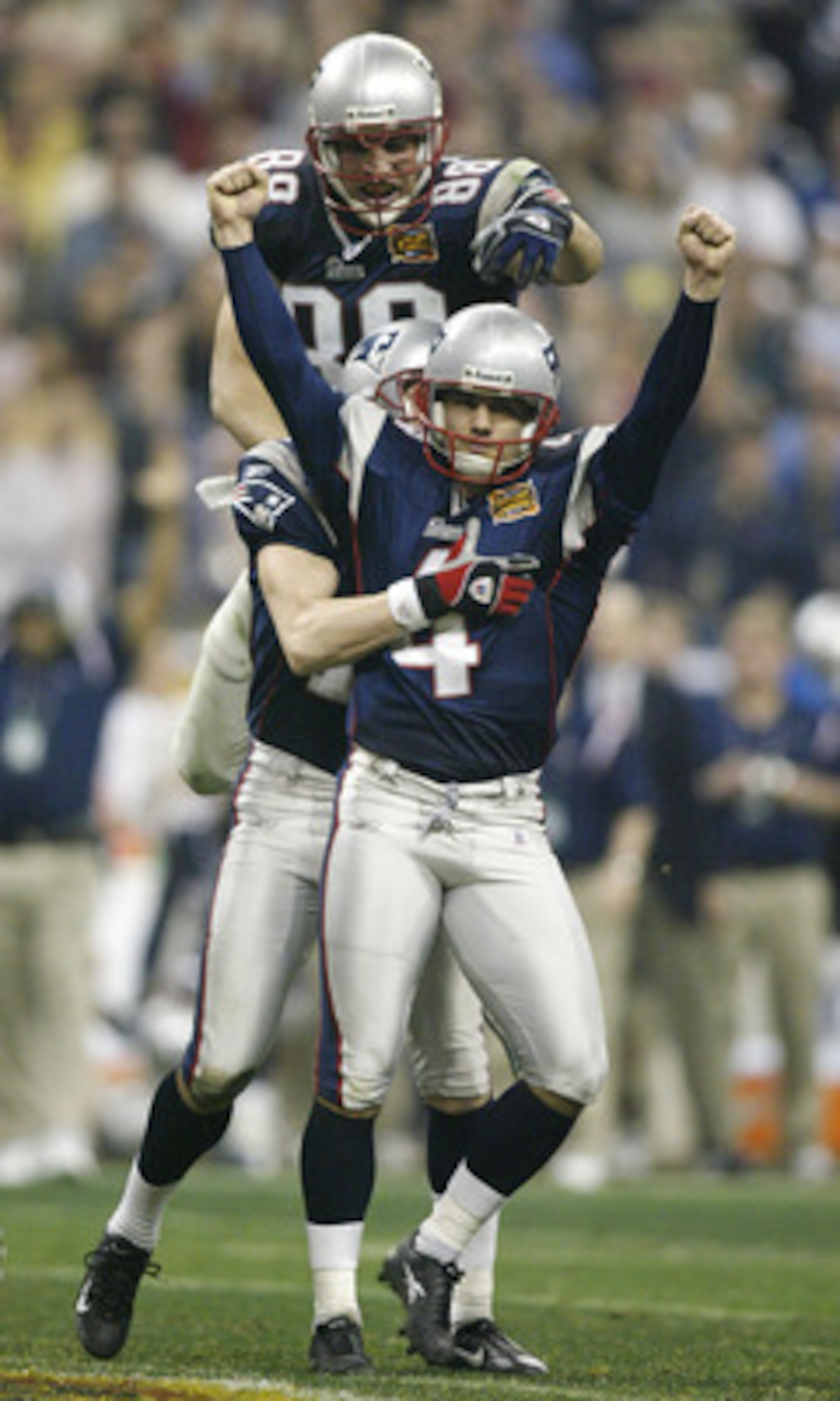 HOUSTON, TX - FEBRUARY 1: Kicker Adam Vinatieri #4 of the New England Patriots celebrates with his teammates Christian Fauria #88 and Ken Walter #13 after kicking a 41-yard game-winning field goal in the forth quarter during Super Bowl XXXVIII against th HOUSTON, TX - FEBRUARY 1: Kicker Adam Vinatieri #4 of the New England Patriots celebrates with his teammates Christian Fauria #88 and Ken Walter #13 after kicking a 41-yard game-winning field goal in the forth quarter during Super Bowl XXXVIII against th