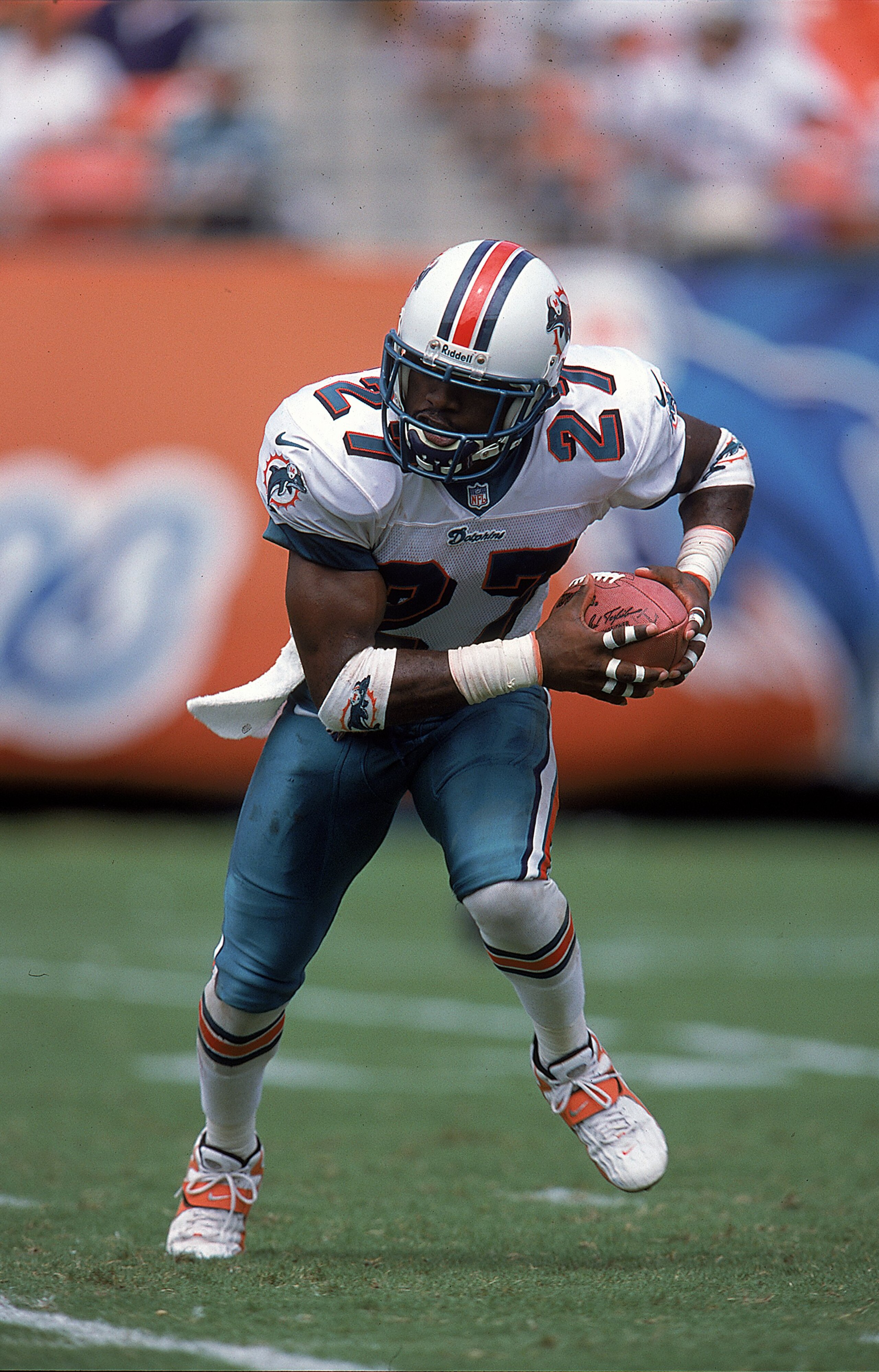 19 Sep 1999:  Terrell Buckley #27 of the Miami Dolphins carries the ball during the game against the Arizona Cardinals at the Pro Player Stadium in Miami, Florida. The Dolphins defeated the Cardinals 19-16. Mandatory Credit: Andy Lyons  /Allsport