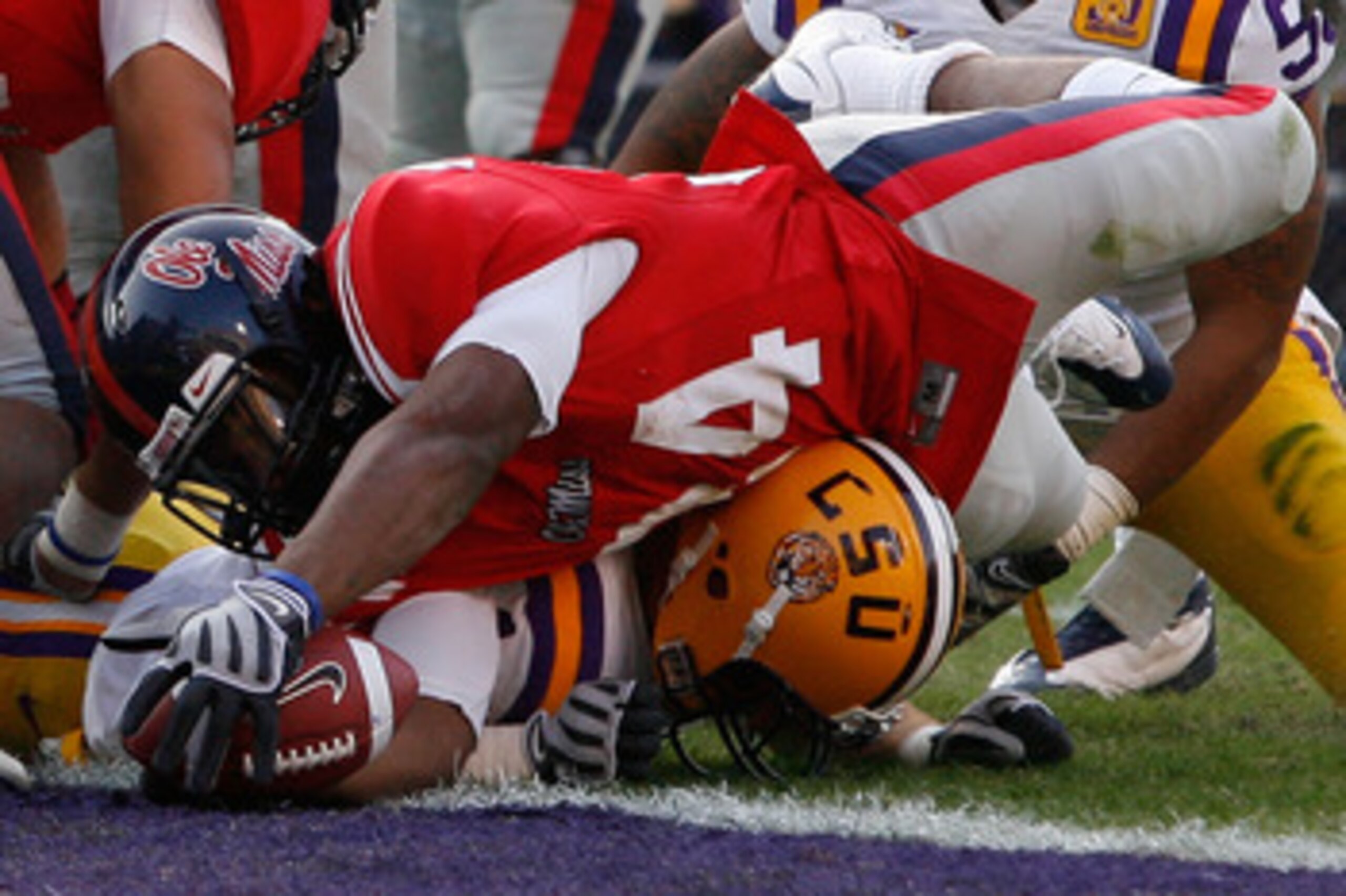 BATON ROUGE, LA - NOVEMBER 22:  Brandon Bolden #34 of the Ole Miss Rebels dives for a touchdown against  the Louisiana State University Tigers  on November 22, 2008 at Tiger Stadium in Baton Rouge, Louisiana.  (Photo by Chris Graythen/Getty Images)