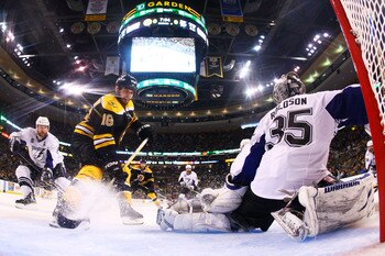 BOSTON, MA - MAY 27:  Nathan Horton #18 of the Boston Bruins shoots his game winning third period goal past Dwayne Roloson #35 of the Tampa Bay Lightning in Game Seven of the Eastern Conference Finals during the 2011 NHL Stanley Cup Playoffs at TD Garden