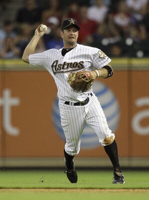 HOUSTON - JUNE 08:  Second baseman Jeff Keppinger #8 of the Houston Astros throws to first base against the St. Louis Cardinals at Minute Maid Park on June 8, 2011 in Houston, Texas.  (Photo by Bob Levey/Getty Images)