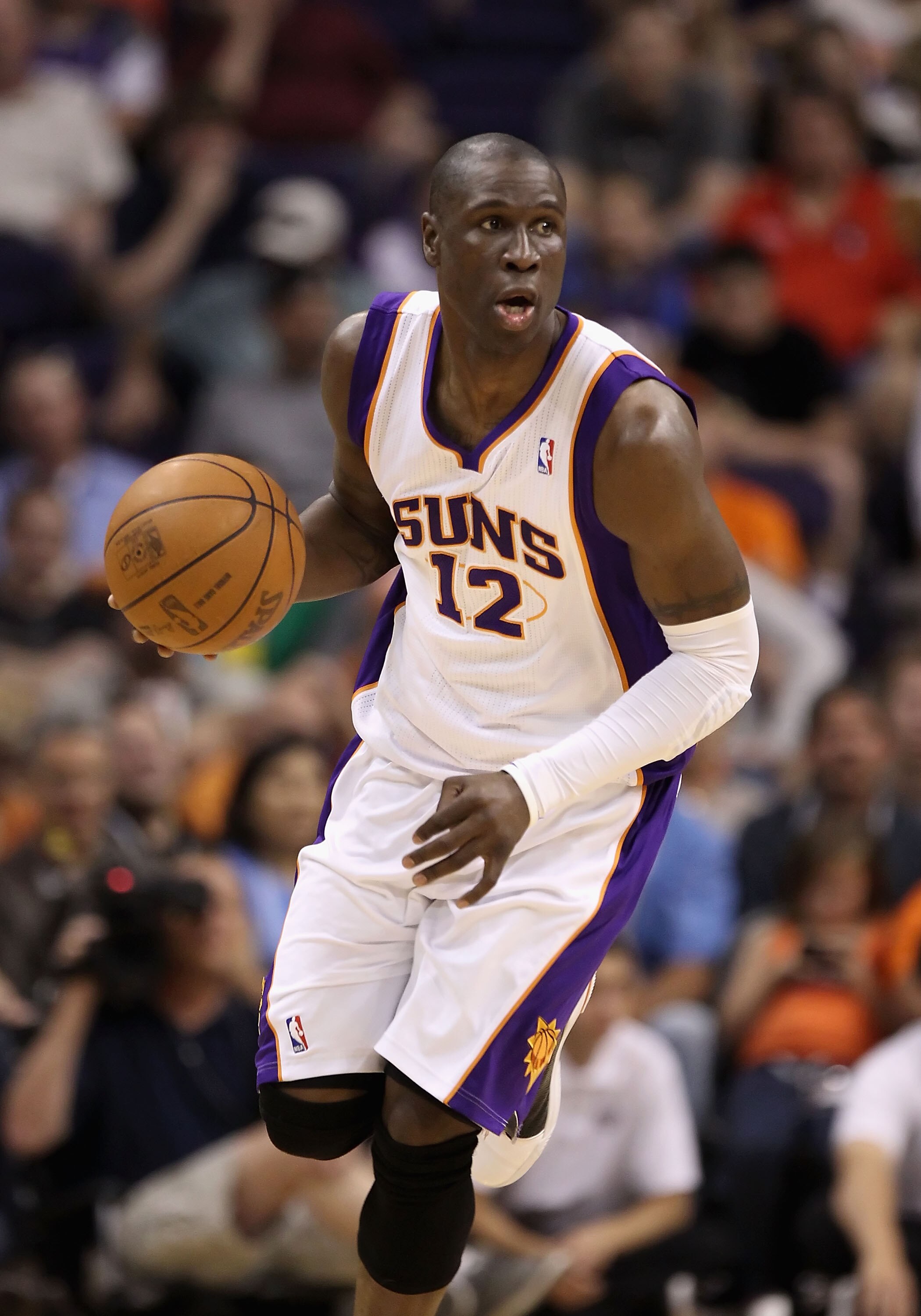 PHOENIX, AZ - MARCH 13:  Mickael Pietrus #12 of the Phoenix Suns handles the ball during the NBA game against the Orlando Magic at US Airways Center on March 13, 2011 in Phoenix, Arizona.  NOTE TO USER: User expressly acknowledges and agrees that, by down