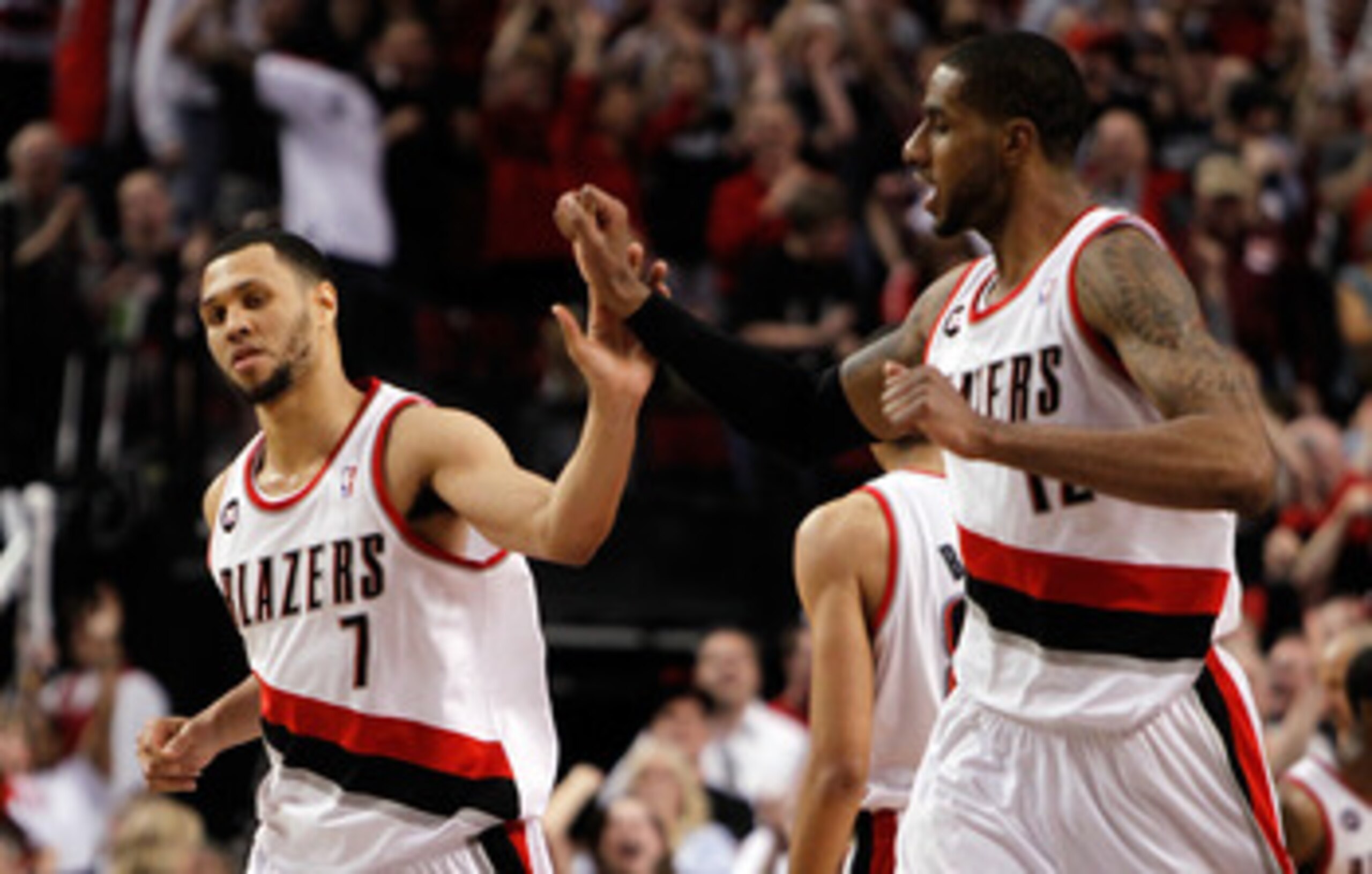 PORTLAND, OR - APRIL 23:  Brandon Roy #7 high fives LaMarcus Aldridge #12 of the Portland Trail Blazers against the Dallas Mavericks in Game Four of the Western Conference Quarterfinals in the 2011 NBA Playoffs on April 23, 2011 at the Rose Garden in Port