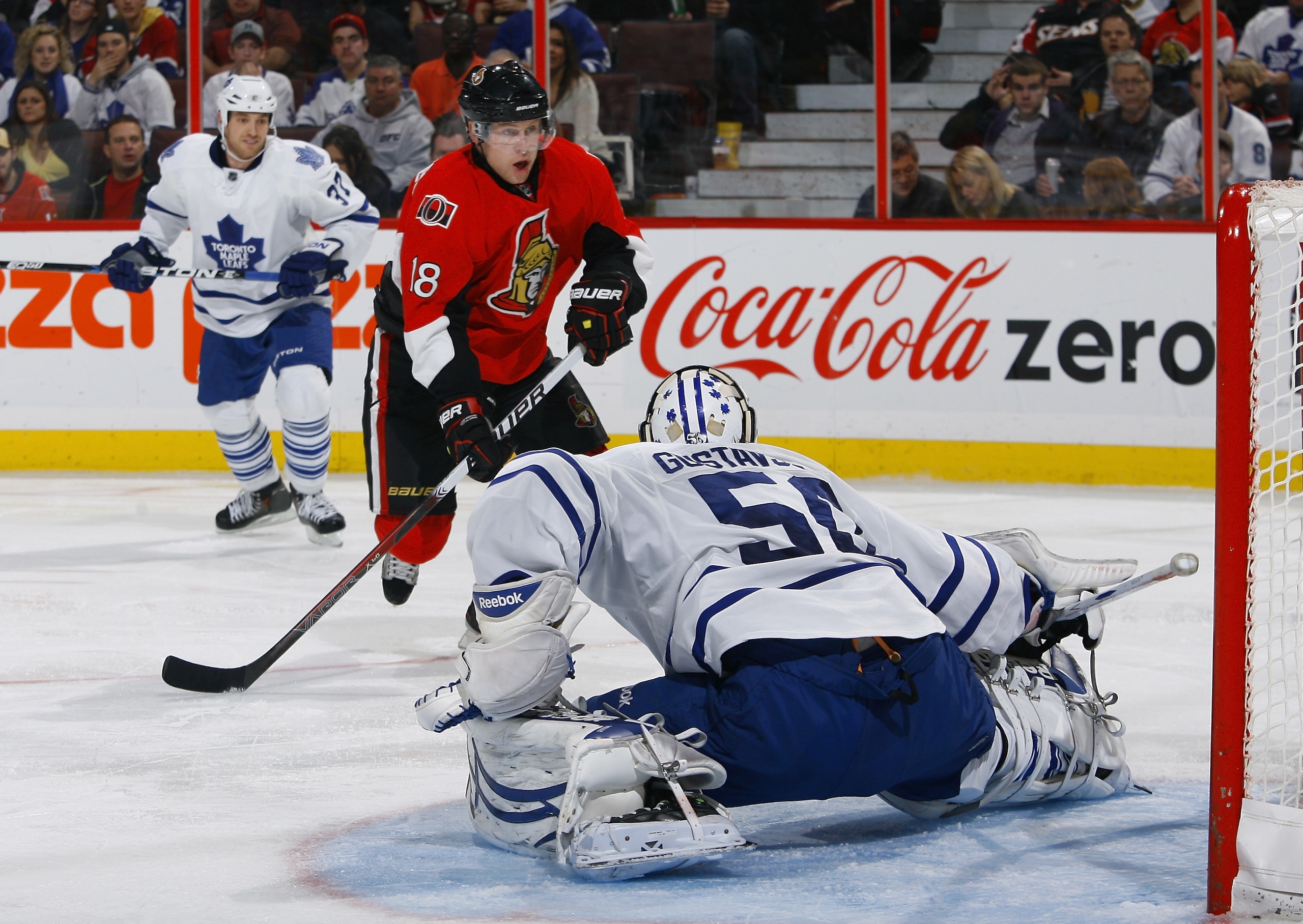 OTTAWA, ON - NOVEMBER 27:  Jesse Winchester #18 of the Ottawa Senators has his wrist shot stopped by a kick save by Jonas Gustavsson #50 of the Toronto Maple Leafs during a game at Scotiabank Place on November 27, 2010 in Ottawa, Ontario, Canada.  (Photo