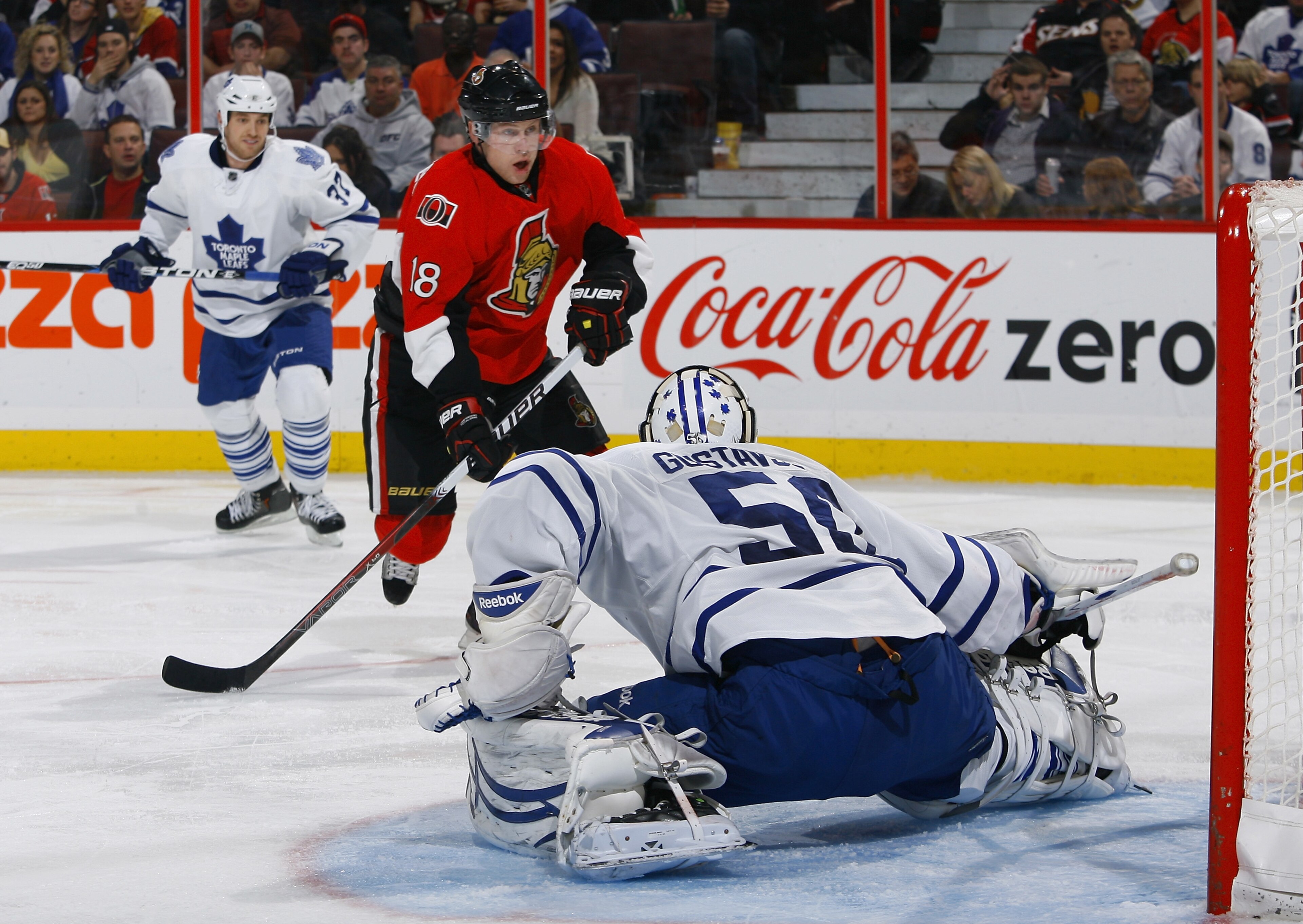 OTTAWA, ON - NOVEMBER 27:  Jesse Winchester #18 of the Ottawa Senators has his wrist shot stopped by a kick save by Jonas Gustavsson #50 of the Toronto Maple Leafs during a game at Scotiabank Place on November 27, 2010 in Ottawa, Ontario, Canada.  (Photo