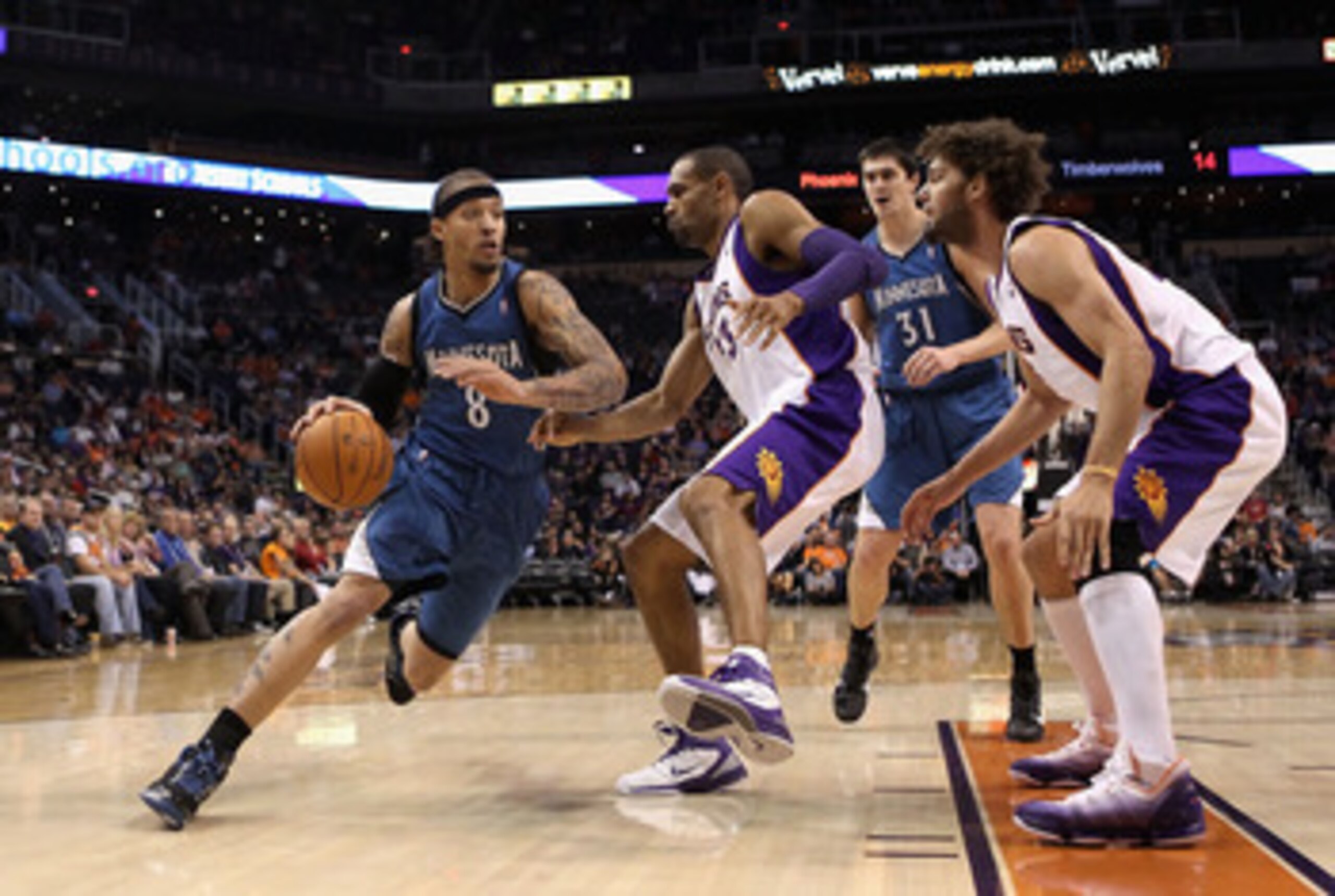 PHOENIX - DECEMBER 15: Michael Beasley #8 of the Minnesota Timberwolves drives the ball agianst Grant Hill #33 of the Phoenix Suns during the NBA game at US Airways Center on December 15, 2010 in Phoenix, Arizona. The Suns defeated the Timberwolves 128- PHOENIX - DECEMBER 15: Michael Beasley #8 of the Minnesota Timberwolves drives the ball agianst Grant Hill #33 of the Phoenix Suns during the NBA game at US Airways Center on December 15, 2010 in Phoenix, Arizona. The Suns defeated the Timberwolves 128-