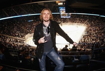 ATLANTA, GA - MARCH 16:  Chad Kroeger of the group Nickelback relaxes during the game between the Atlanta Thrashers and the New York Islanders at Philips Arena on March 16, 2006 in Atlanta, Georgia. The Thrashers defeated the Islanders 4-2.  (Photo by Sco