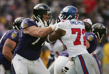 BALTIMORE - DECEMBER 12:  Defensive end Osi Umenyiora #72 of the New York Giants attempts to push his way past offensive tackle Ethan Brooks #77 of the Baltimore Ravens during the game at M&T Bank Stadium on December 12, 2004 in Baltimore, Maryland. The R
