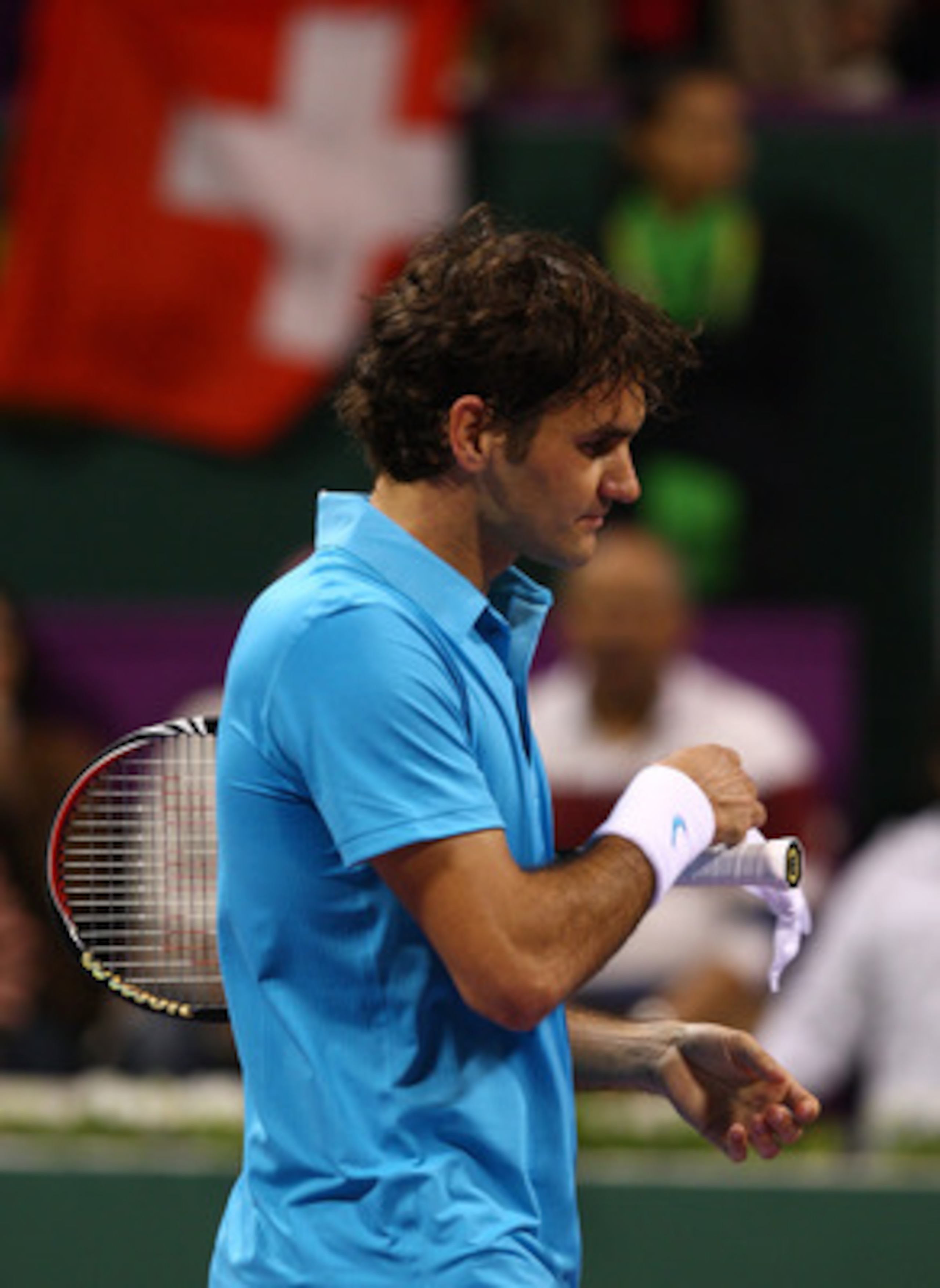 DOHA, QATAR - JANUARY 08:  A dejected looking Roger Federer of Switzerland reacts after his match against Nikolay Davydenko of Russia during the Semi- final match of the ATP Qatar Exxon Mobil Open at the Khalifa International Tennis and Squash Complex on 
