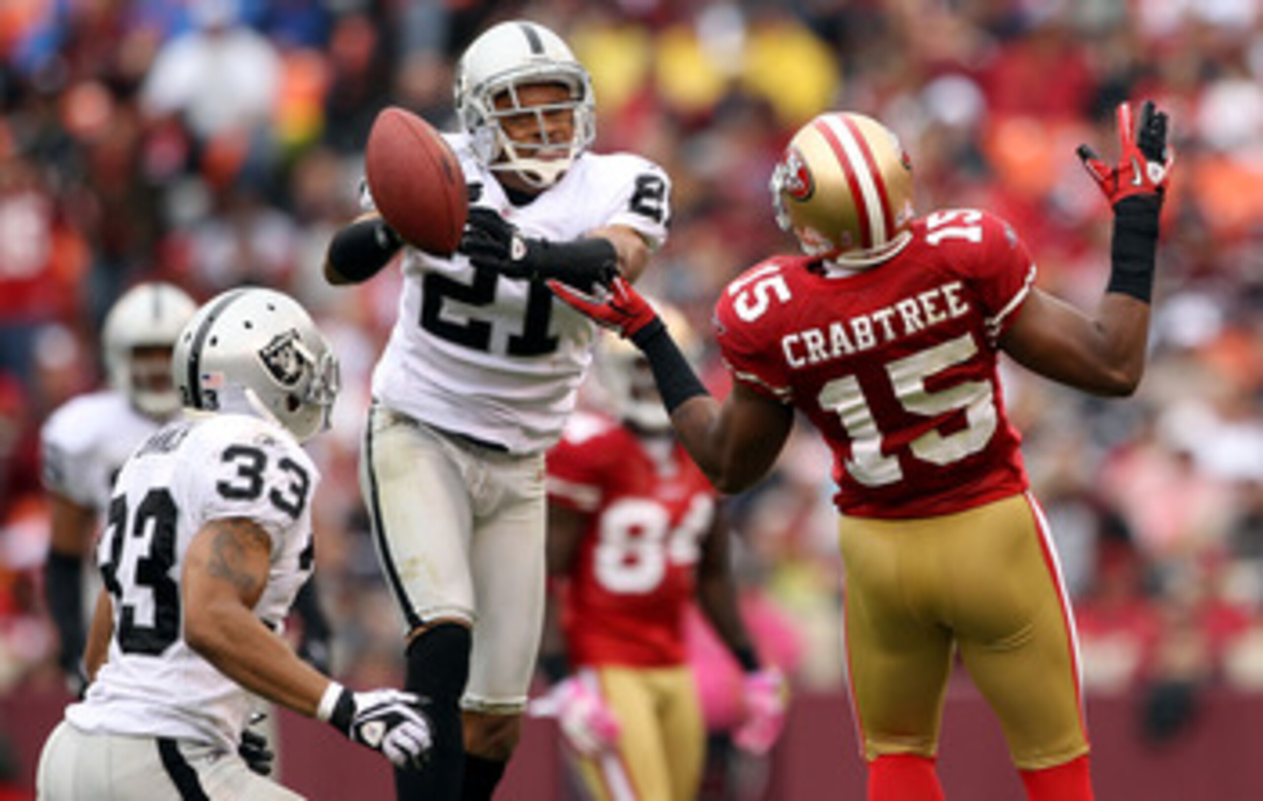SAN FRANCISCO - OCTOBER 17:  Nnamdi Asomugha  #21 of the Oakland Raiders breaks up a pass intended for Michael Crabtree #15 of the San Francisco 49ers at Candlestick Park on October 17, 2010 in San Francisco, California.  (Photo by Ezra Shaw/Getty Images)