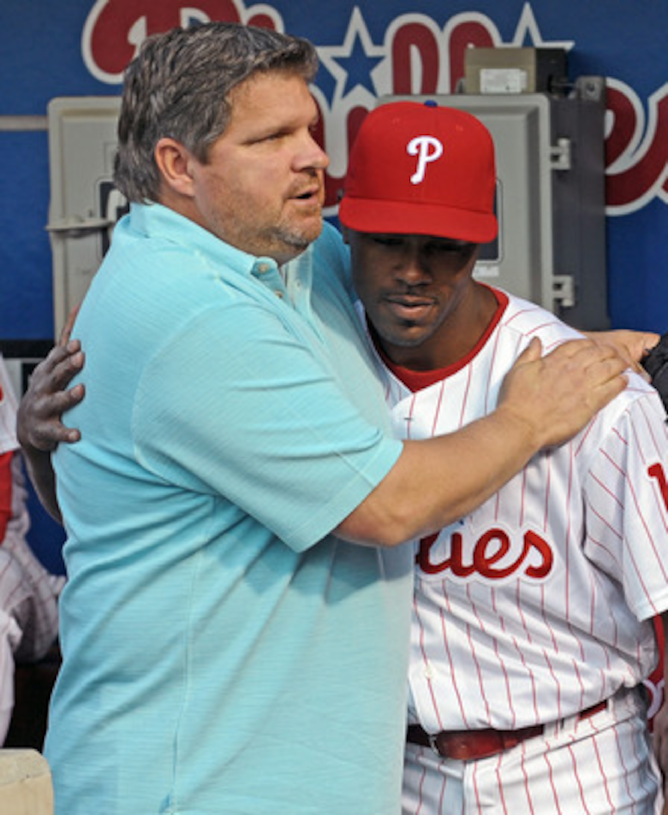 PHILADELPHIA - APRIL 17: Jimmy Rollins #11 of the Philadelphia Phillies hugs former player John Kruk during a tribute to recently departed Philadelphia Phillies announcer Harry Kalas before the game against the San Diego Padres on April 17, 2009 at Citize