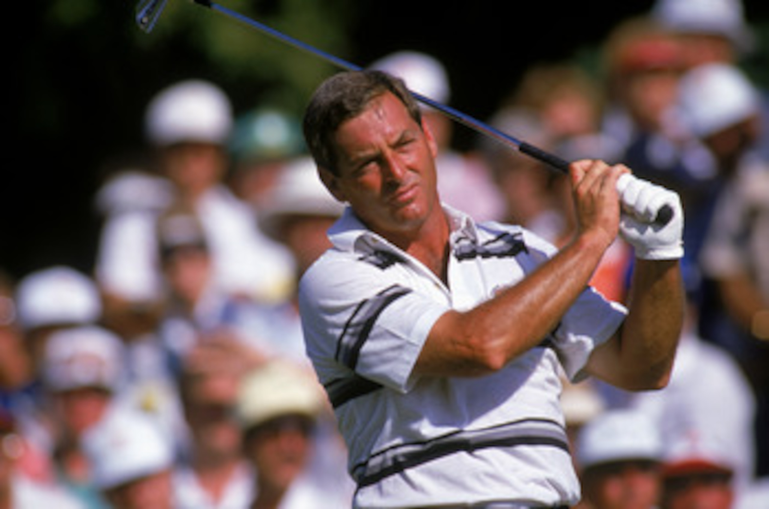 1988:  Fuzzy Zoeller hits the ball during a 1988 PGA game. (Mike Powell/Getty Images)