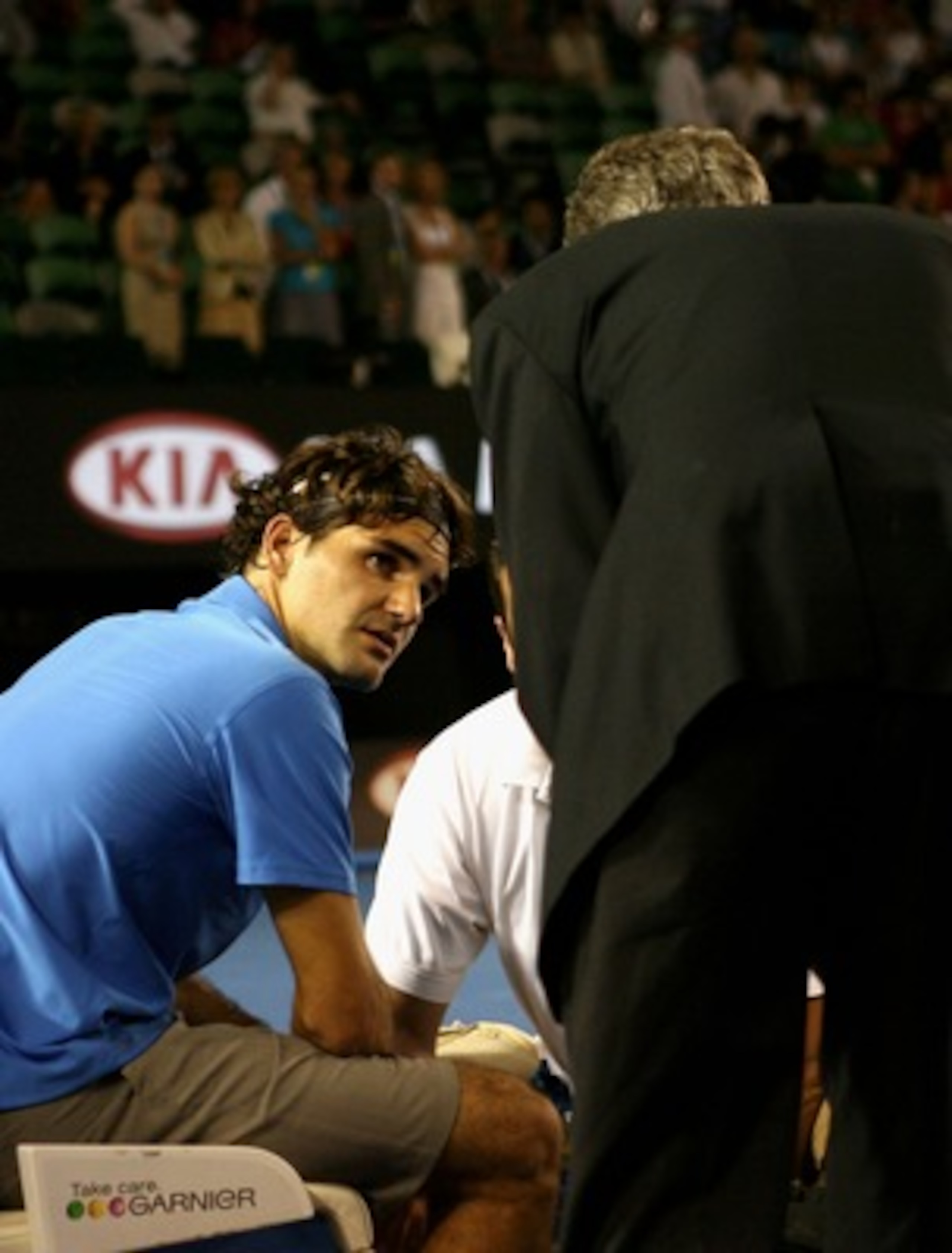 MELBOURNE, AUSTRALIA - JANUARY 19:  Roger Federer of Switzerland receives medical treatment on his foot during his third round match against Janko Tipsarevic of Serbia on day six of the Australian Open 2008 at Melbourne Park on January 19, 2008 in Melbour