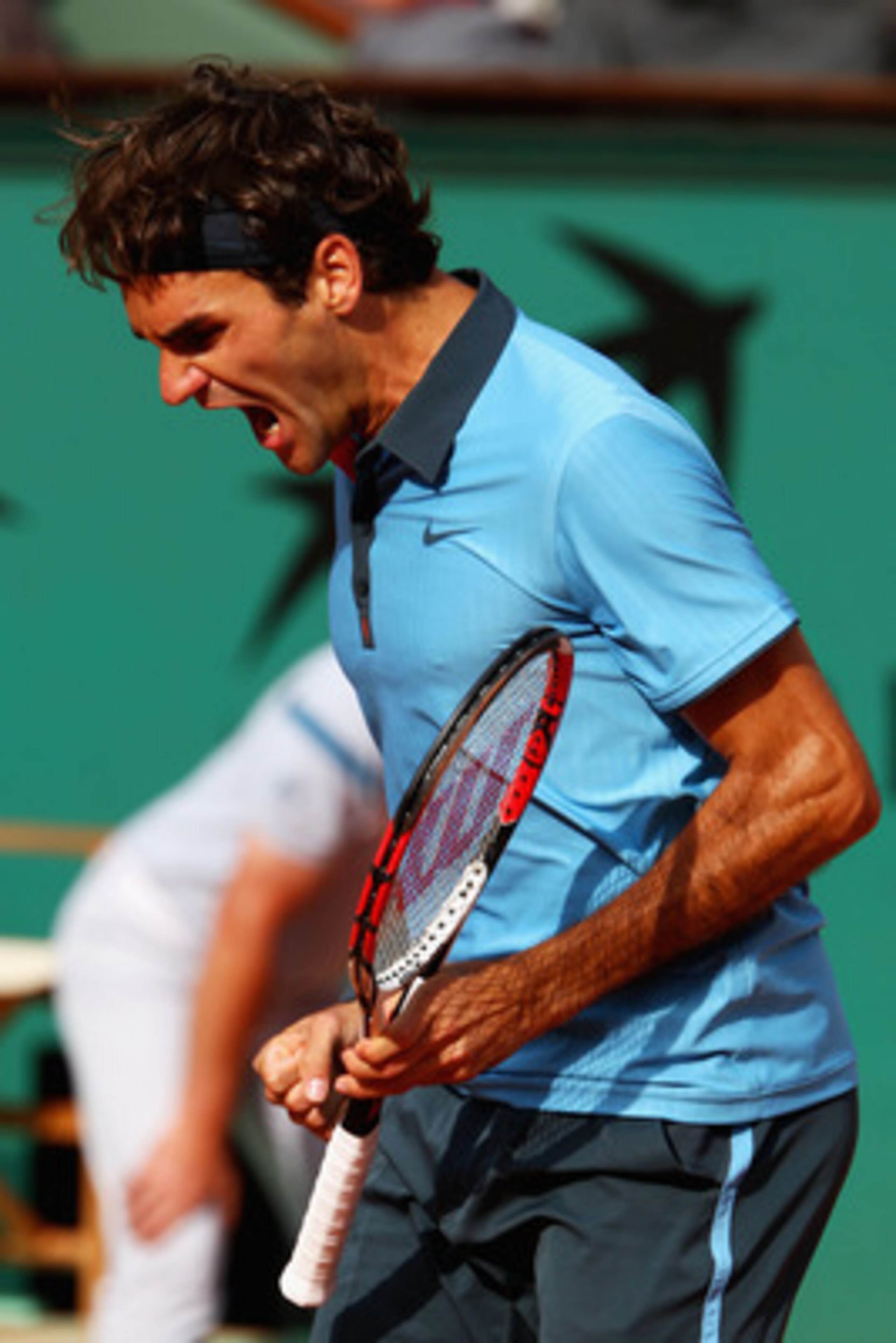 PARIS - JUNE 05:  Roger Federer of Switzerland celebrates winning the second set during the Men's Singles Semi Final match against Juan Martin Del Potro of Argentina on day thirteen of the French Open at Roland Garros on June 5, 2009 in Paris, France.  (P