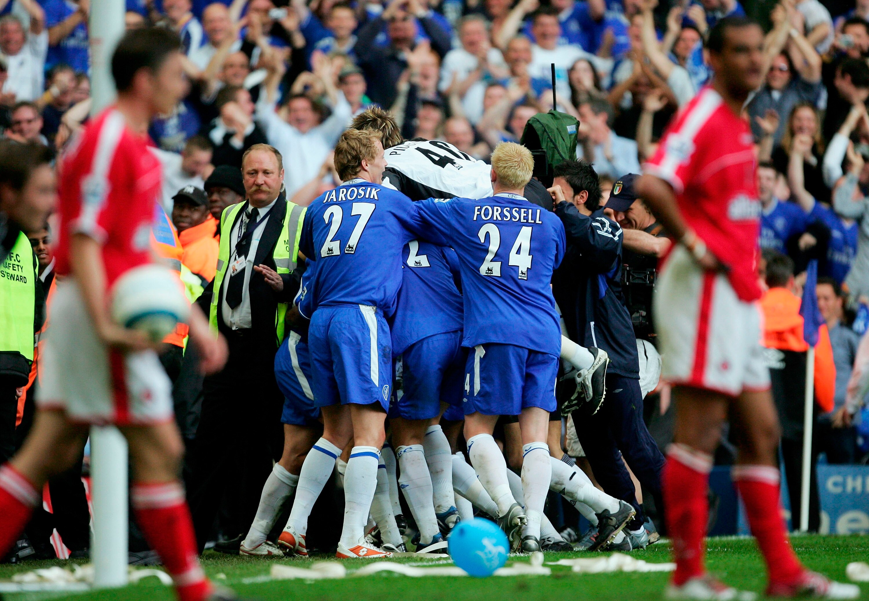 LONDON - MAY 7:  Team mates swamp Claude Makelele of Chelsea after he scores the winning goal in the final seconds during the Barclays Premiership match between Chelsea and Charlton at Stamford Bridge on May 7, 2005 in London, England.  (Photo by Mike Hew