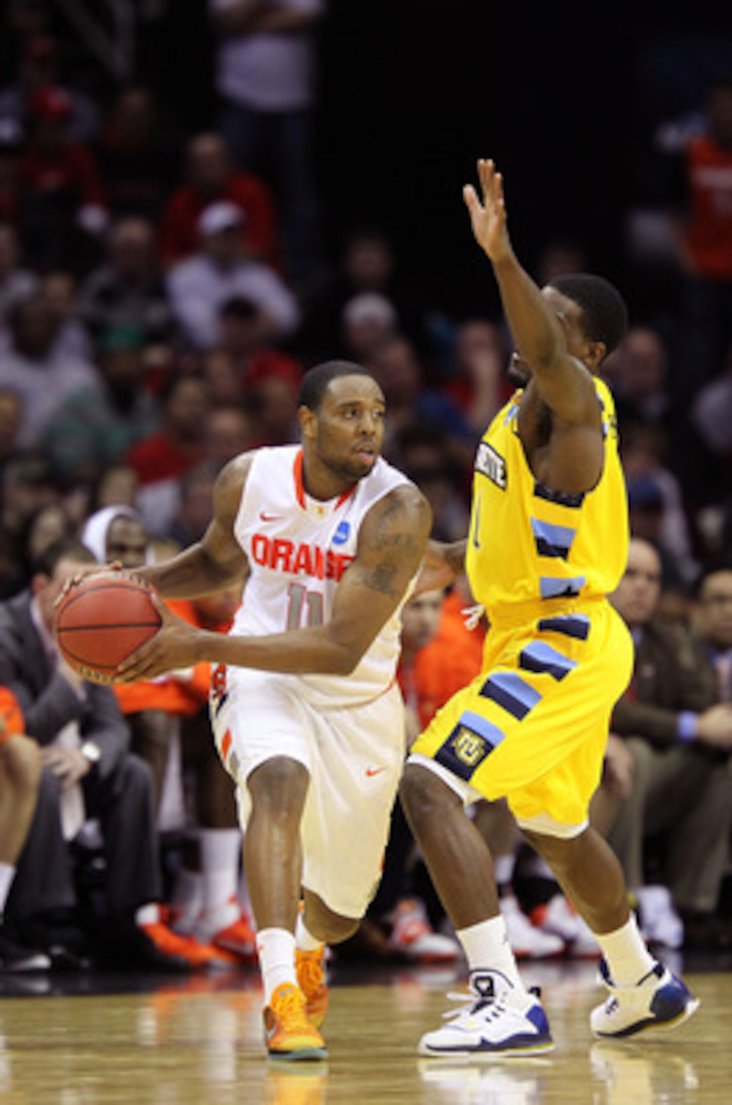 CLEVELAND, OH - MARCH 20: Scoop Jardine #11 of the Syracuse Orange handles the ball against the Marquette Golden Eagles during the third of the 2011 NCAA men's basketball tournament at Quicken Loans Arena on March 20, 2011 in Cleveland, Ohio.  (Photo by A