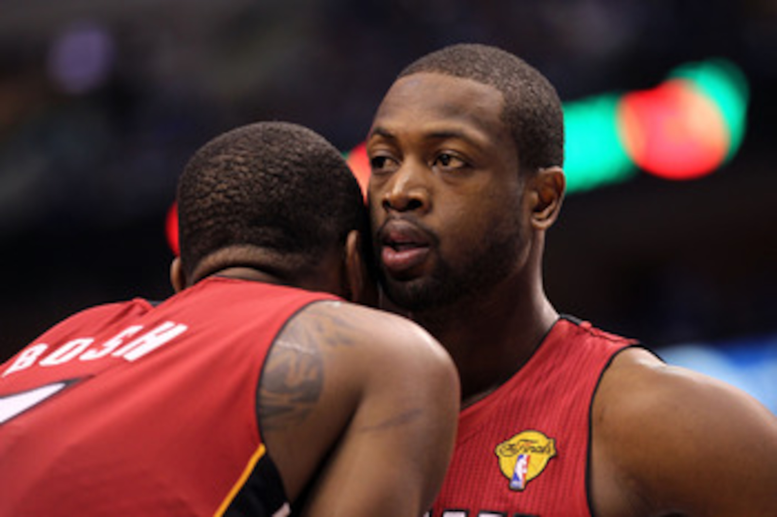 DALLAS, TX - JUNE 07:  Dwyane Wade #3 and Chris Bosh #1 of the Miami Heat talk on court against the Dallas Mavericks in Game Four of the 2011 NBA Finals at American Airlines Center on June 7, 2011 in Dallas, Texas. NOTE TO USER: User expressly acknowledge