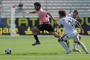 PARMA, ITALY - MAY 01:  Javier Matias Pastore of US Citta di Palermo turns Rolf Gunther Feltscher Martinez of Parma FC during the Serie A match between Parma FC and US Citta di Palermo at Stadio Ennio Tardini on May 1, 2011 in Parma, Italy.  (Photo by Val