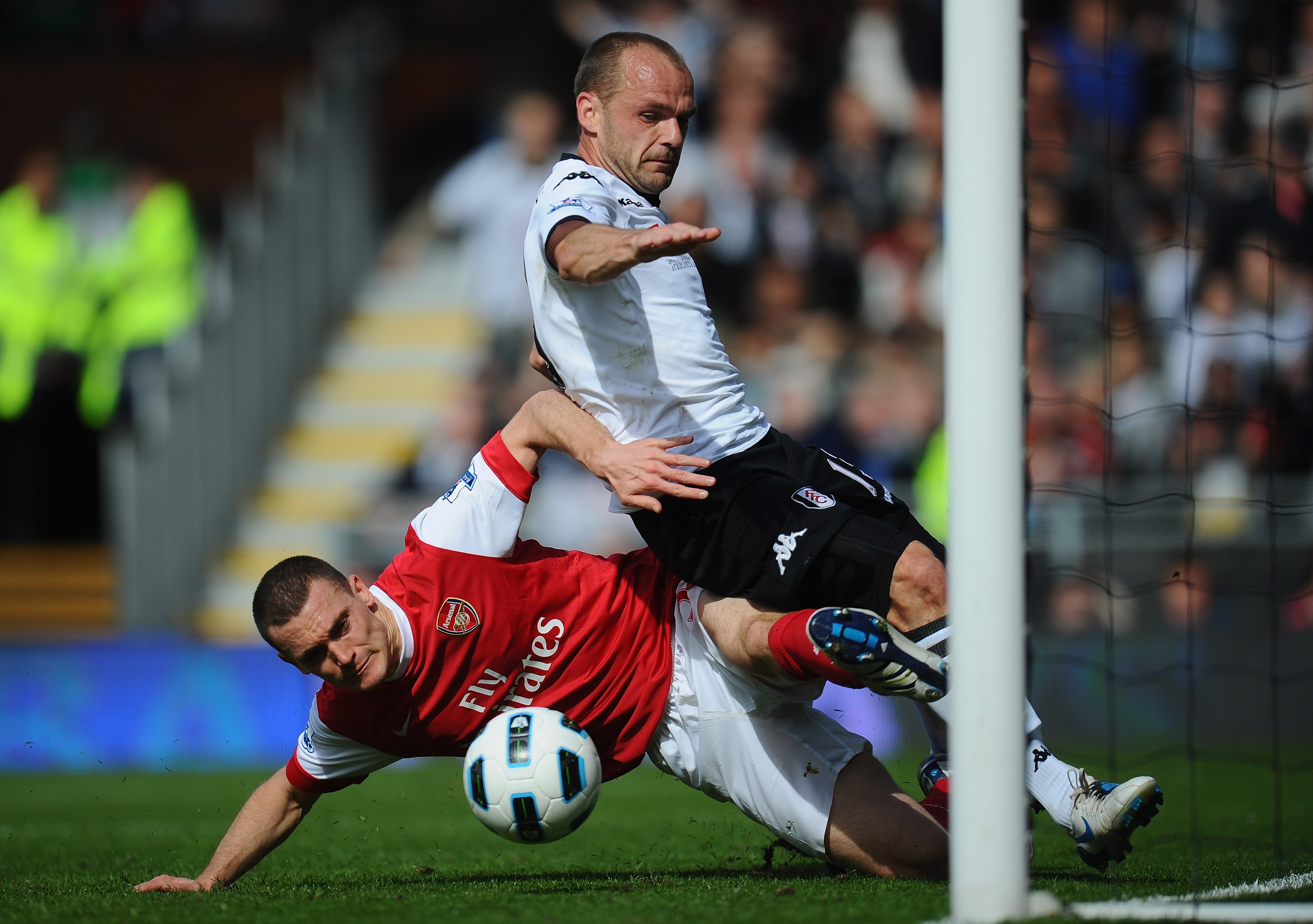 LONDON, ENGLAND - MAY 22:  Danny Murphy of Fulham is denied a chance by Thomas Vermaelen of Arsenal during the Barclays Premier League match between Fulham and Arsenal at Craven Cottage on May 22, 2011 in London, England.  (Photo by Clive Mason/Getty Imag