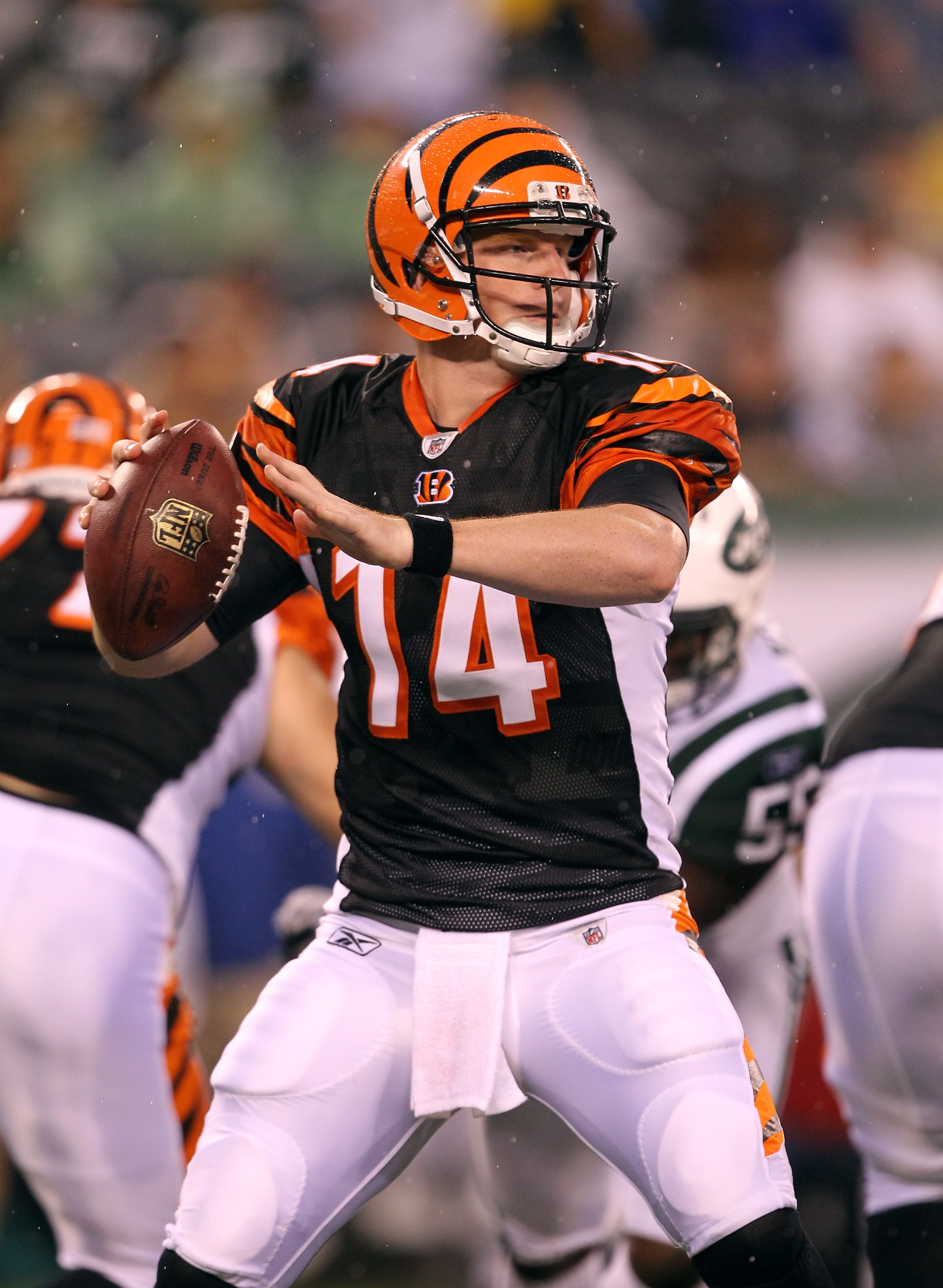 EAST RUTHERFORD, NJ - AUGUST 21:  Andy Dalton #14 of the Cincinnati Bengals looks to pass against the New York Jets during their pre season game on August 21, 2011 at the New Meadowlands Stadium in East Rutherford, New Jersey.  (Photo by Al Bello/Getty Im
