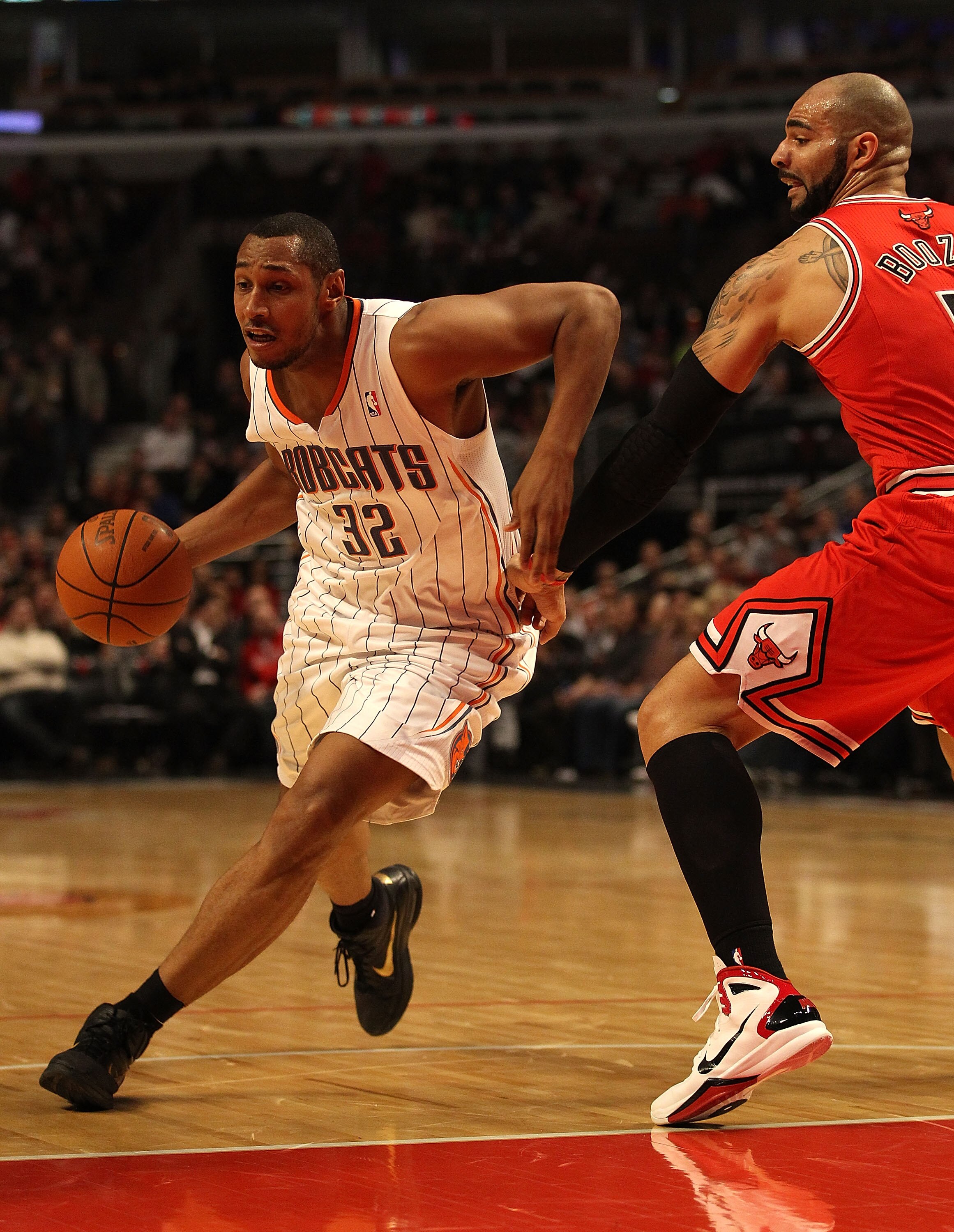 CHICAGO, IL - FEBRUARY 15: Boris Diaw #32 of the Charlotte Bobcats moves around Carlos Boozer #5 of the Chicago Bulls at the United Center on February 15, 2011 in Chicago, Illinois. The Bulls defeated the Bobcats 106-94. NOTE TO USER: User expressly ackno