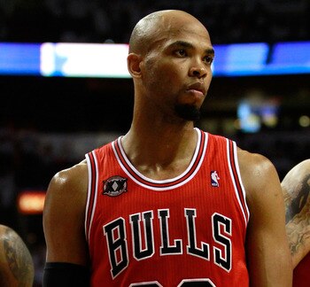 MIAMI, FL - MAY 22:  (L-R) Taj Gibson #22 and Carlos Boozer #5 of the Chicago Bulls look on against the Miami Heat in Game Three of the Eastern Conference Finals during the 2011 NBA Playoffs on May 22, 2011 at American Airlines Arena in Miami, Florida.  N