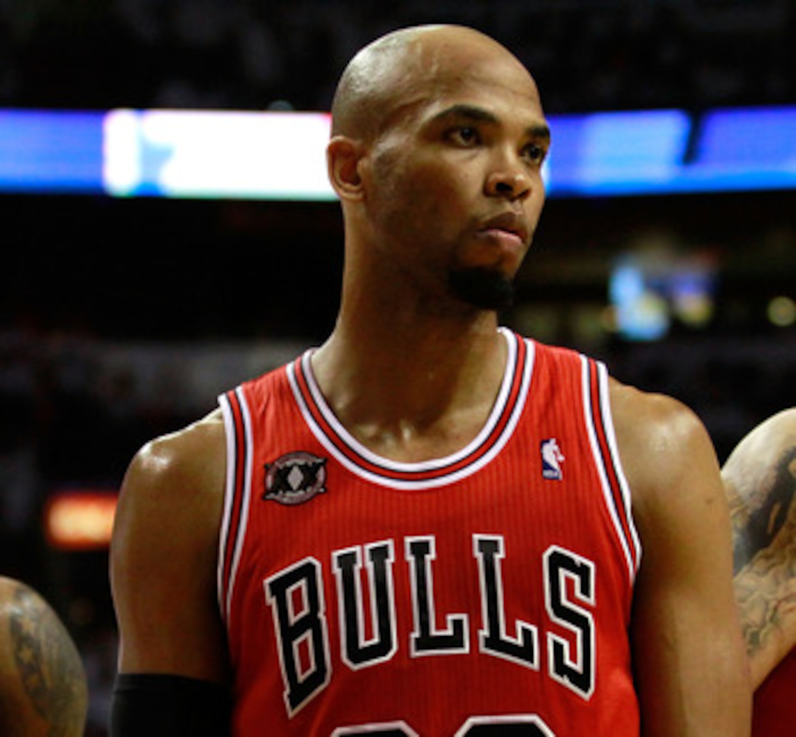 MIAMI, FL - MAY 22:  (L-R) Taj Gibson #22 and Carlos Boozer #5 of the Chicago Bulls look on against the Miami Heat in Game Three of the Eastern Conference Finals during the 2011 NBA Playoffs on May 22, 2011 at American Airlines Arena in Miami, Florida.  N