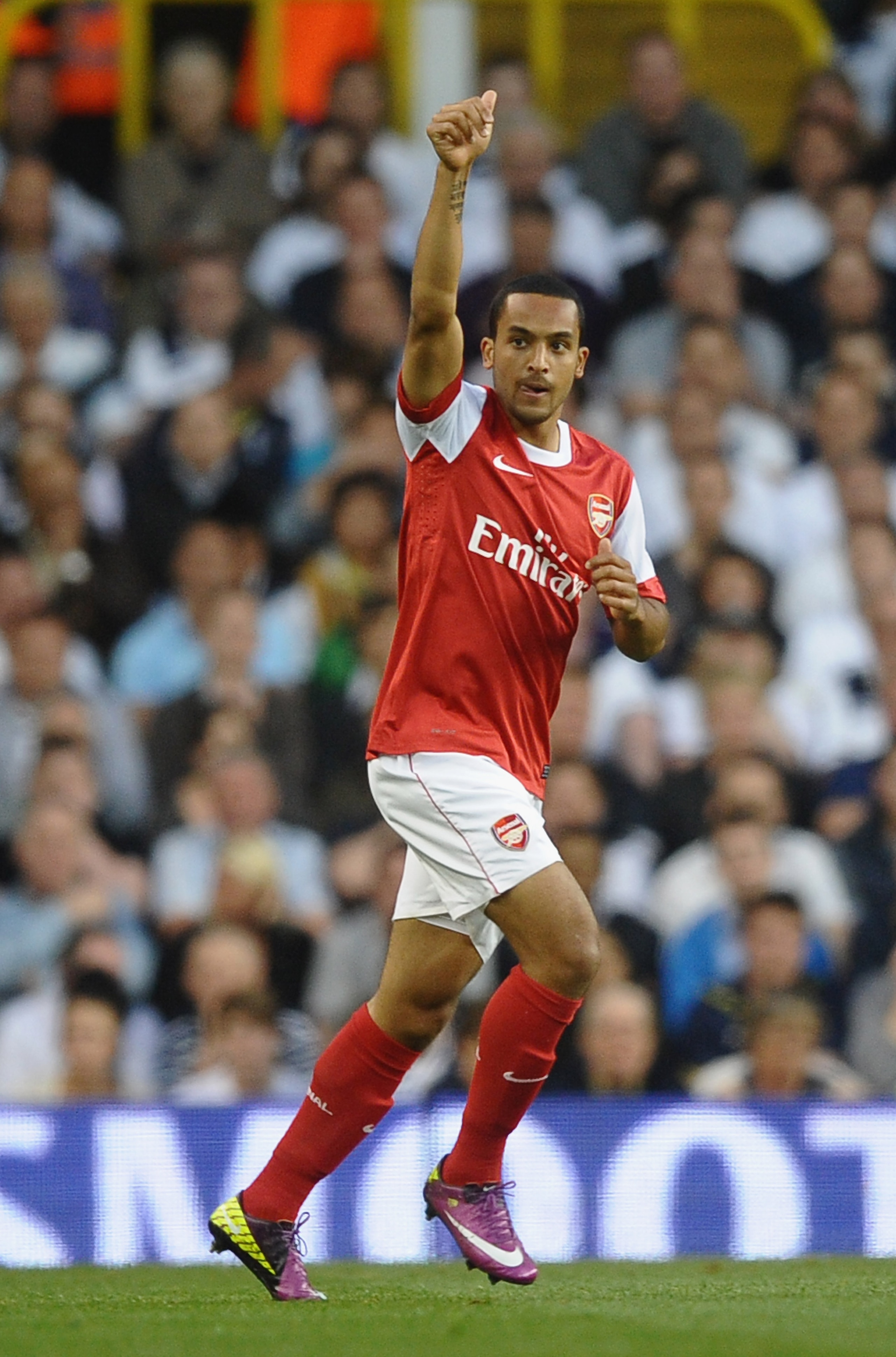 LONDON, ENGLAND - APRIL 20: Theo Walcott of Arsenal celebrates scoring the opening goal during the Barclays Premier League match between Tottenham Hotspur and Arsenal at White Hart Lane on April 20, 2011 in London, England. (Photo by Laurence Griffiths/ LONDON, ENGLAND - APRIL 20: Theo Walcott of Arsenal celebrates scoring the opening goal during the Barclays Premier League match between Tottenham Hotspur and Arsenal at White Hart Lane on April 20, 2011 in London, England. (Photo by Laurence Griffiths/