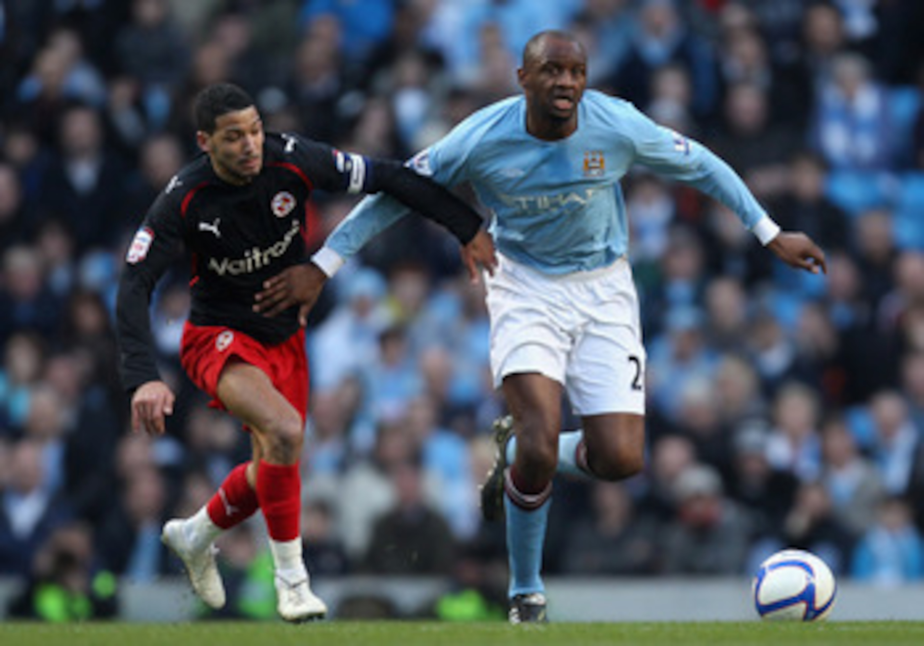 MANCHESTER, ENGLAND - MARCH 13:  Patrick Vieira of Manchester City holds off the challenge by Jobi McAnuff of Reading during the FA Cup sponsored by E.On Sixth Round match between Manchester City and Reading at the City of Manchester Stadium on March 13,
