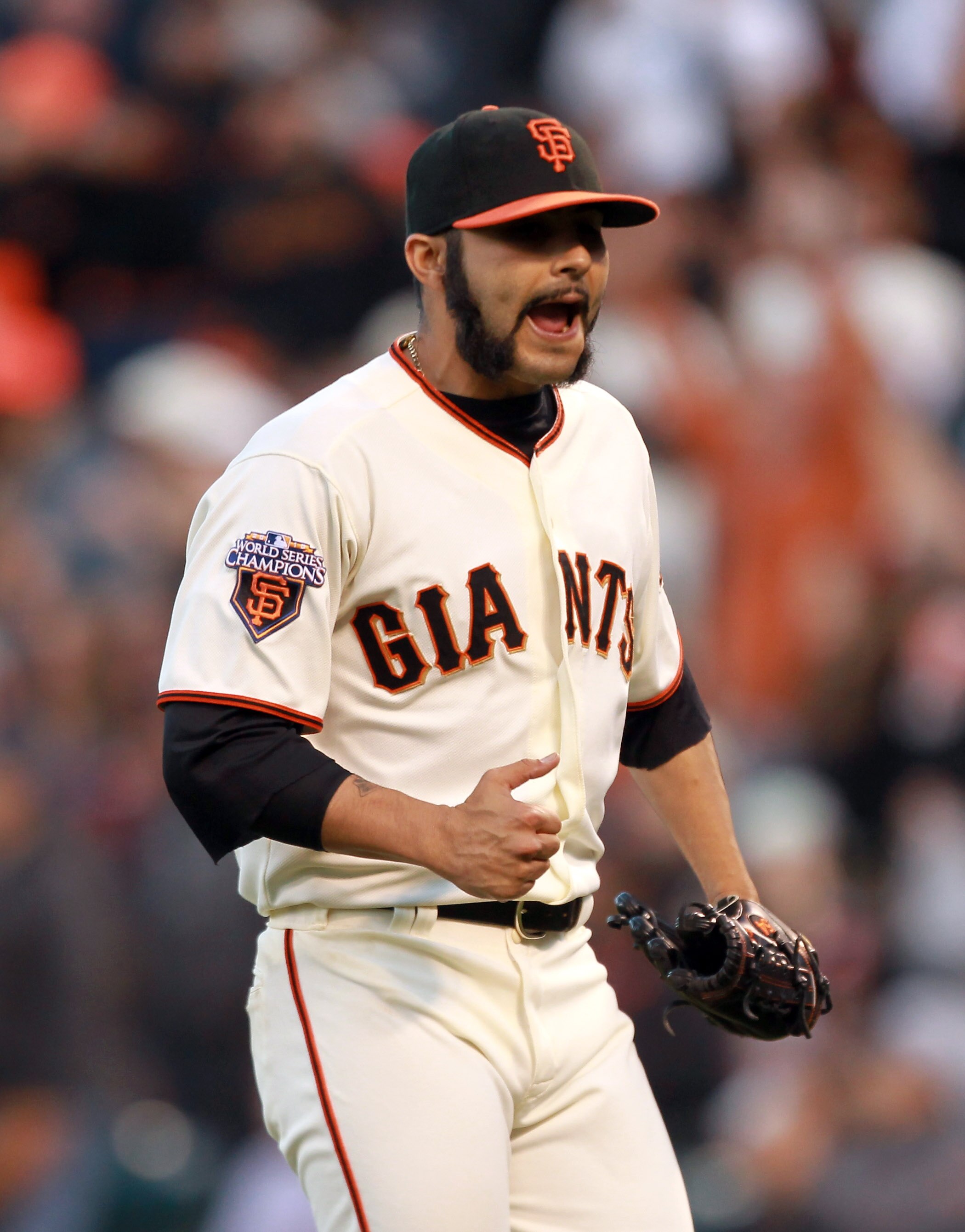 SAN FRANCISCO, CA - JUNE 12:  Sergio Romo #54 of the San Francisco Giants reacts after the last out of the eighth inning against the Cincinnati Reds at AT&T Park on June 12, 2011 in San Francisco, California.  (Photo by Ezra Shaw/Getty Images)