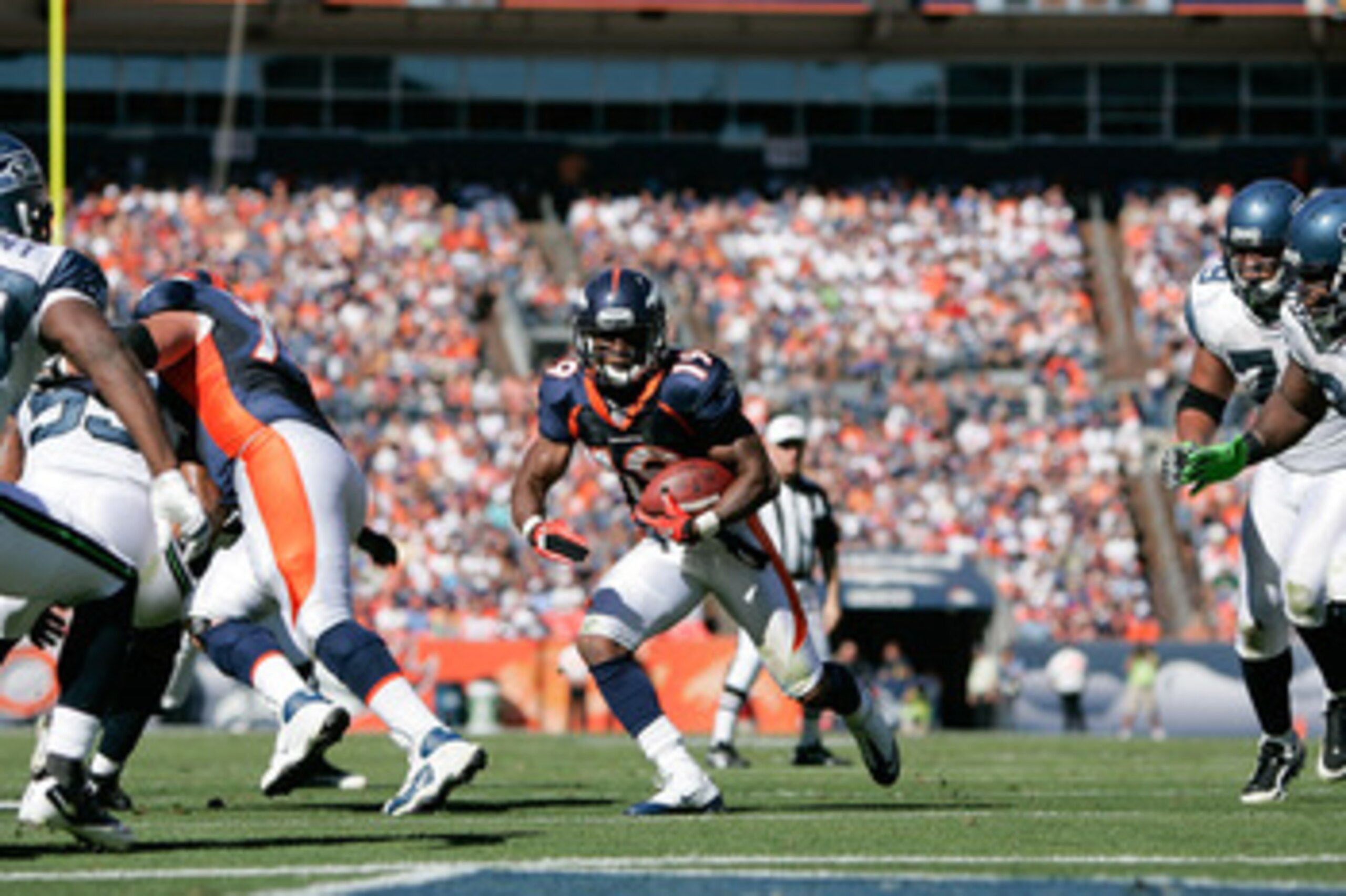 DENVER - SEPTEMBER 19: Wide receiver Eddie Royal #19 of the Denver Broncos runs through a hole in the Seattle Seahawks defense after making a catch during an NFL game at INVESCO Field at Mile High on September 19, 2010 in Denver, Colorado. (Photo by Jus DENVER - SEPTEMBER 19: Wide receiver Eddie Royal #19 of the Denver Broncos runs through a hole in the Seattle Seahawks defense after making a catch during an NFL game at INVESCO Field at Mile High on September 19, 2010 in Denver, Colorado. (Photo by Jus
