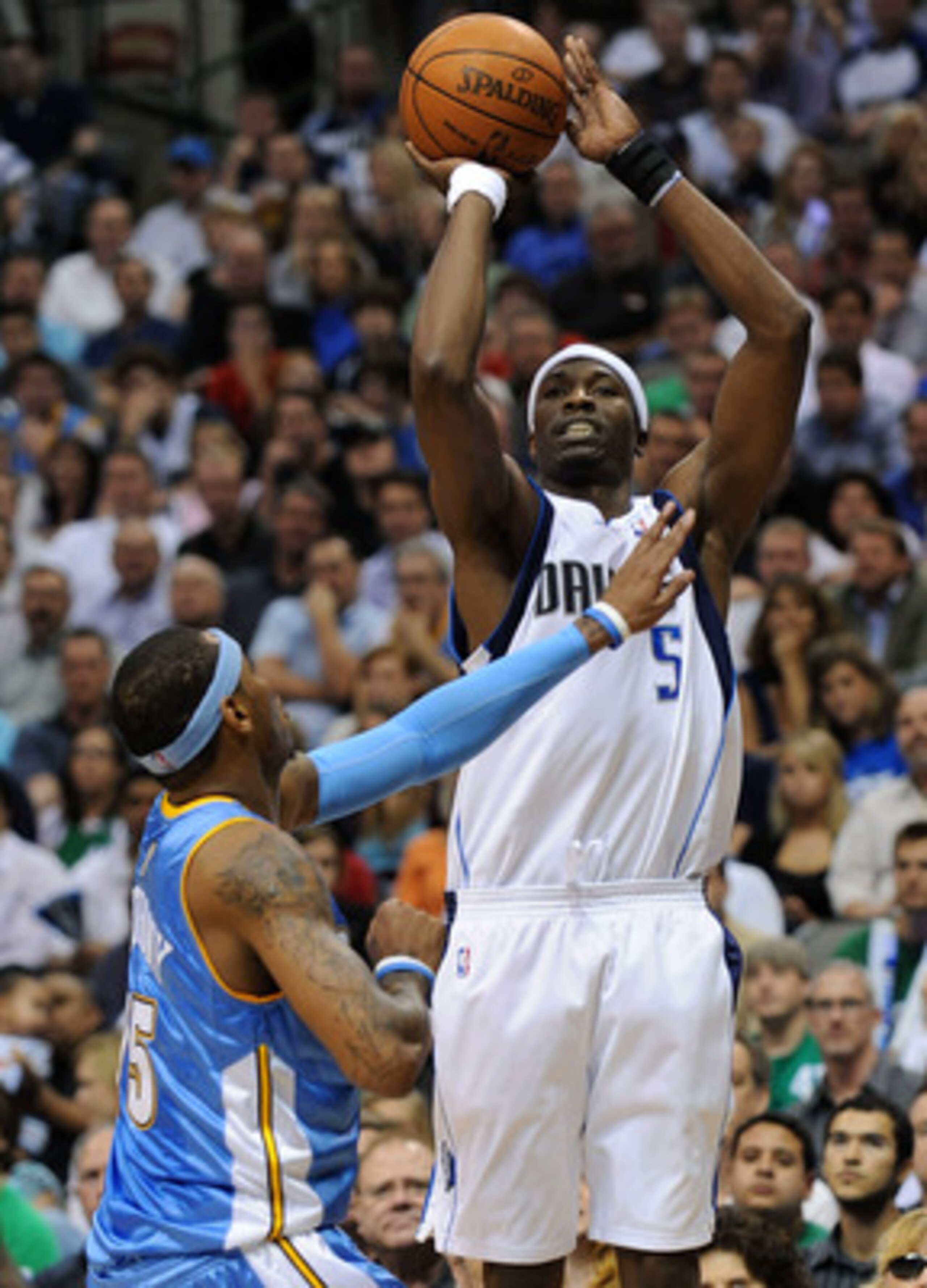 DALLAS - MAY 11:  Forward Josh Howard #5 of the Dallas Mavericks takes a shot against Carmelo Anthony #15 of the Denver Nuggets in Game Four of the Western Conference Semifinals during the 2009 NBA Playoffs at American Airlines Center on May 11, 2009 in D