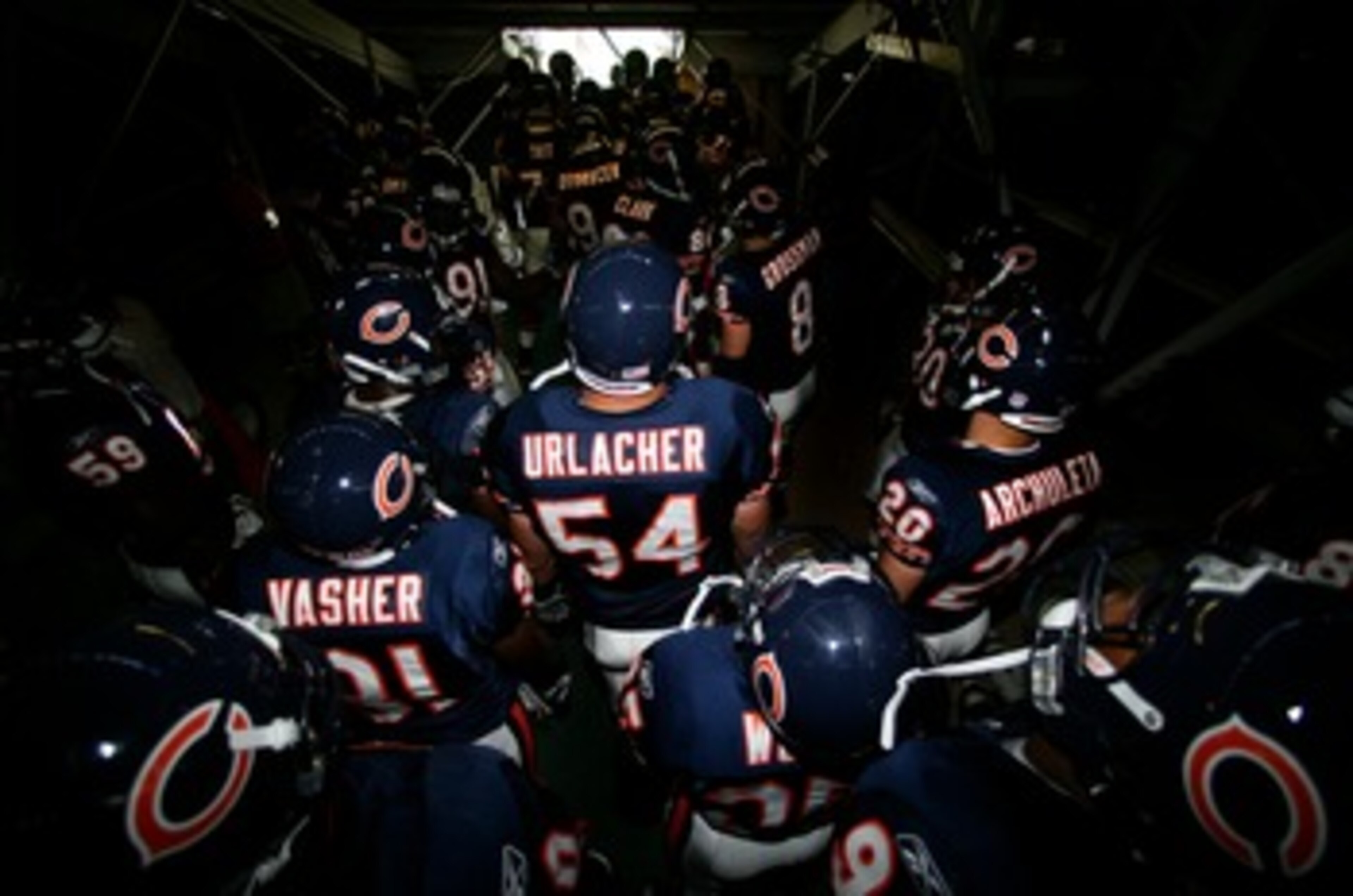 SAN DIEGO - SEPTEMBER 9:   Linebacker Brian Urlacher #54 of the Chicago Bears and his teammates prepare to enter the game against San Diego Chargers at Qualcomm Stadium September 9, 2007 in San Diego, California.  (Photo by Donald Miralle/Getty Images)