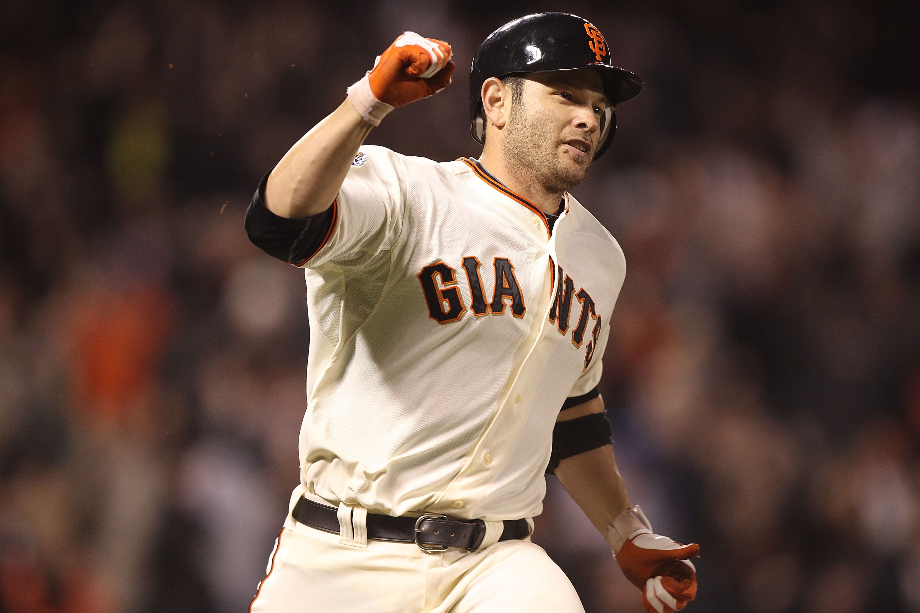 SAN FRANCISCO, CA - JUNE 06:  Freddy Sanchez #21 of the San Francisco Giants celebrates after the game winning hit in the 13th inning against the Washington Nationals during an MLB game at AT&T Park on June 6, 2011 in San Francisco, California.  (Photo by