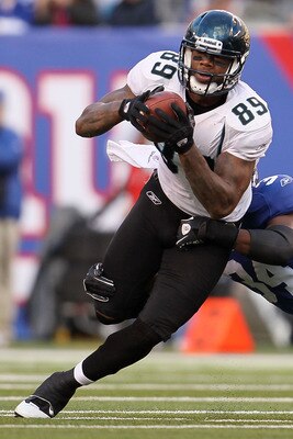 EAST RUTHERFORD, NJ - NOVEMBER 28: Marcedes Lewis #89 of the Jacksonville Jaguars tries to break out of a tackle against the New York Giants at New Meadowlands Stadium on November 28, 2010 in East Rutherford, New Jersey.  (Photo by Chris McGrath/Getty Ima