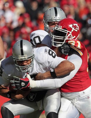 KANSAS CITY, MO - JANUARY 02:  Quarterback Jason Campbell #8 of the Oakland Raiders is sacked by Tamba Hali #91 of the Kansas City Chiefs during the game on January 2, 2011 at Arrowhead Stadium in Kansas City, Missouri.  (Photo by Jamie Squire/Getty Image