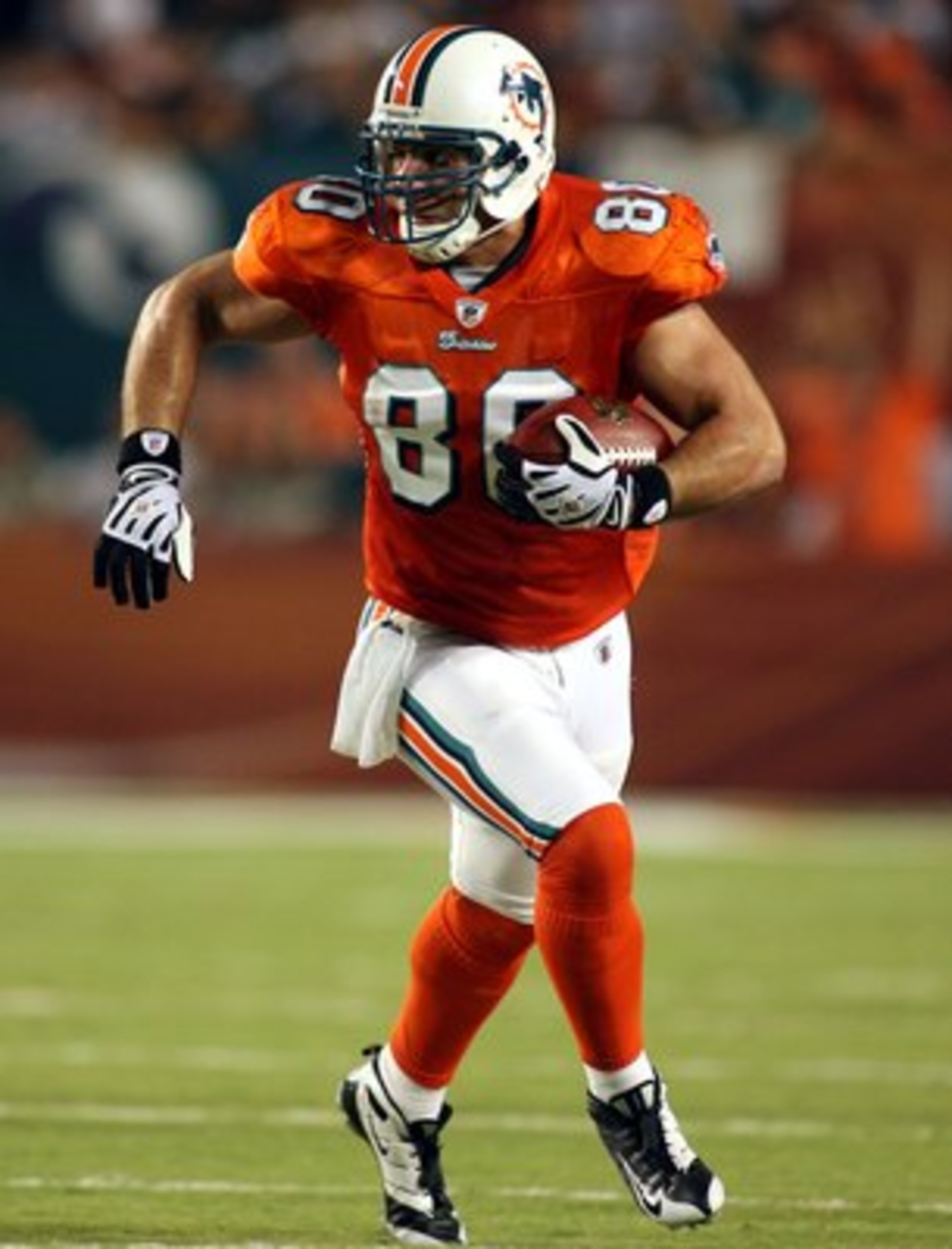 MIAMI - OCTOBER 12:  Tight end Anthony Fasano #80 of the Miami Dolphins runs against the New York Jets at Land Shark Stadium on October 12, 2009 in Miami, Florida.  Miami defeated New York 31-27. (Photo by Marc Serota/Getty Images)
