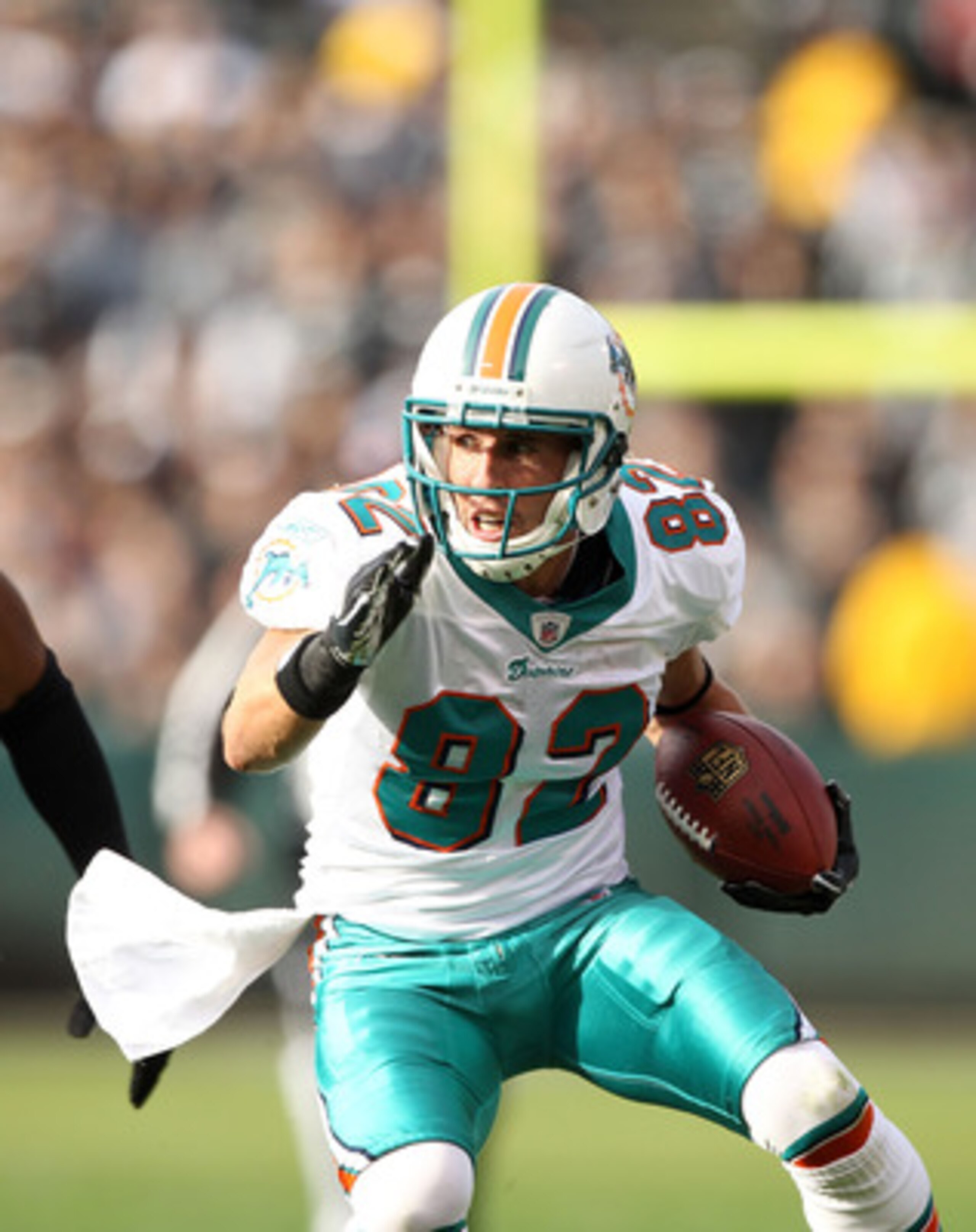 OAKLAND, CA - NOVEMBER 28:  Brian Hartline #82 of the Miami Dolphins in action against the Oakland Raiders at Oakland-Alameda County Coliseum on November 28, 2010 in Oakland, California.  (Photo by Ezra Shaw/Getty Images)
