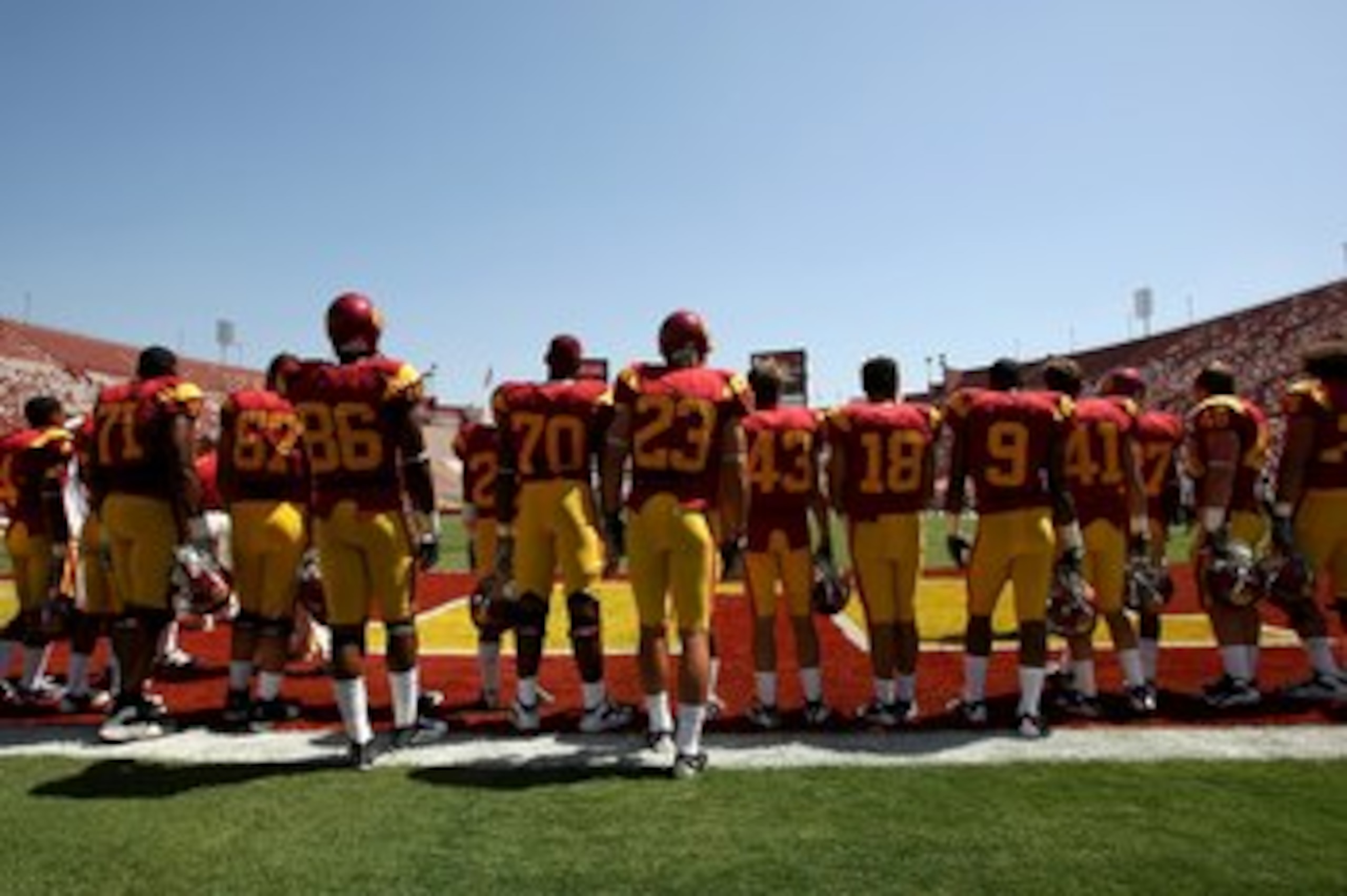 LOS ANGELES - SEPTEMBER 5:  The USC Trojans stand in a tribute to team friend and fan Ryan Davidson, who passed away earlier this year at the age of 16, during pregame ceremonies befoe playing the San Jose State Spartans on September 5, 2009 at the Los An