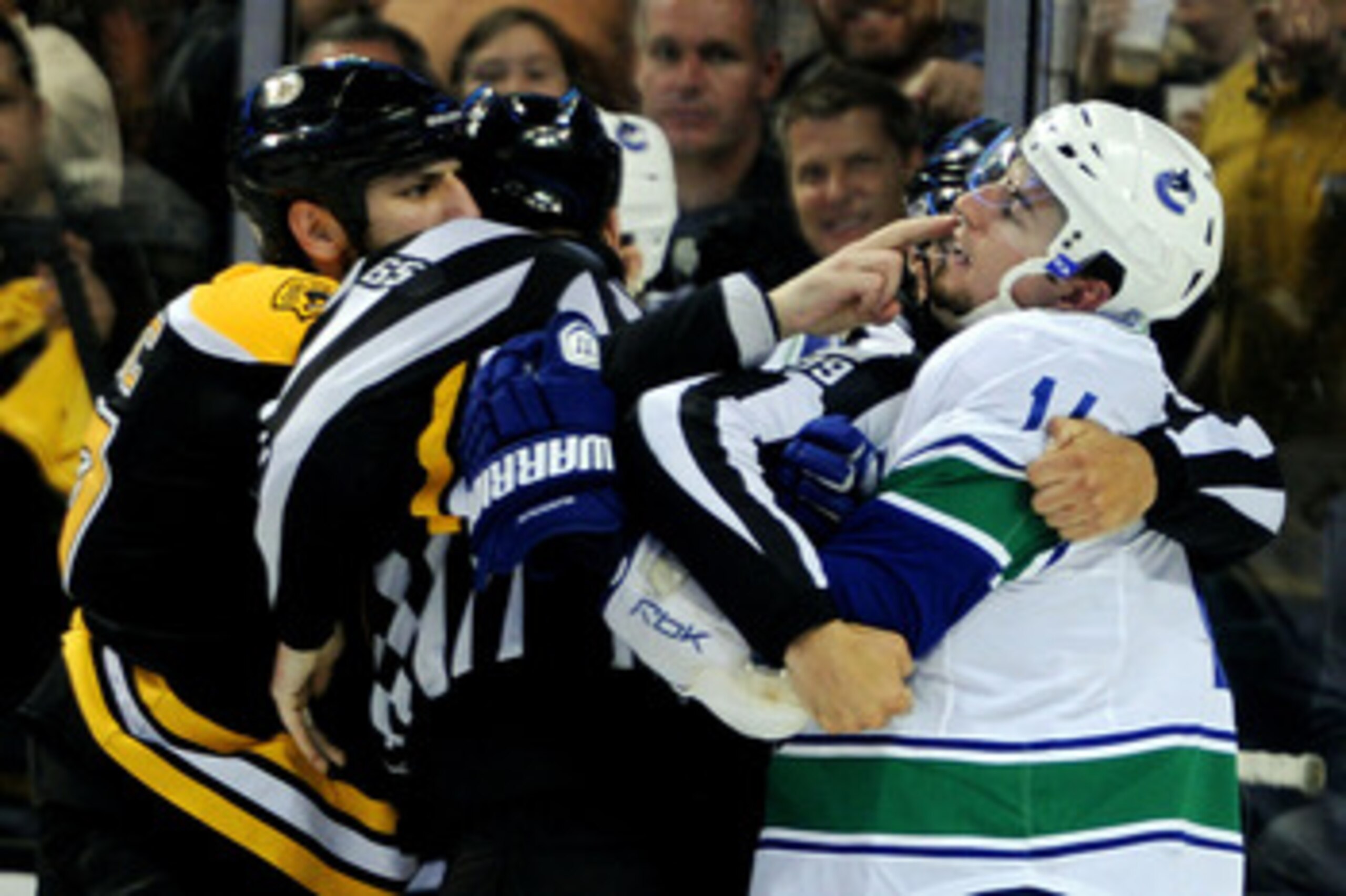 BOSTON, MA - JUNE 06:  Milan Lucic #17 of the Boston Bruins taunts Alex Burrows #14 of the Vancouver Canucks during Game Three of the 2011 NHL Stanley Cup Final at TD Garden on June 6, 2011 in Boston, Massachusetts.  (Photo by Harry How/Getty Images)