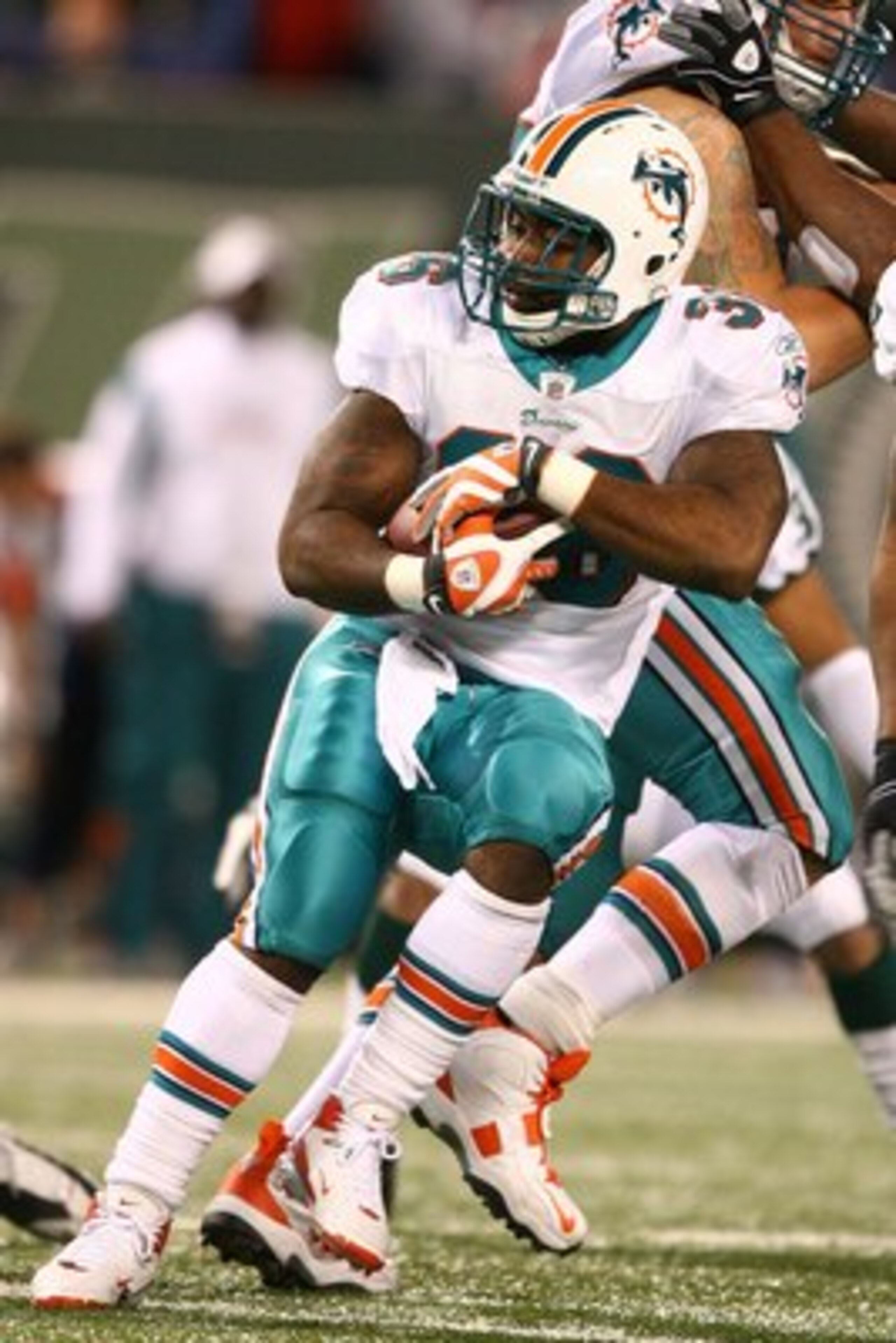 EAST RUTHERFORD, NJ - DECEMBER 28:  Lousaka Polite #36  of The Miami Dolphins runs the ball against The New York Jets during their game on December 28, 2008 at Giants Stadium in East Rutherford, New Jersey.  (Photo by Al Bello/Getty Images)