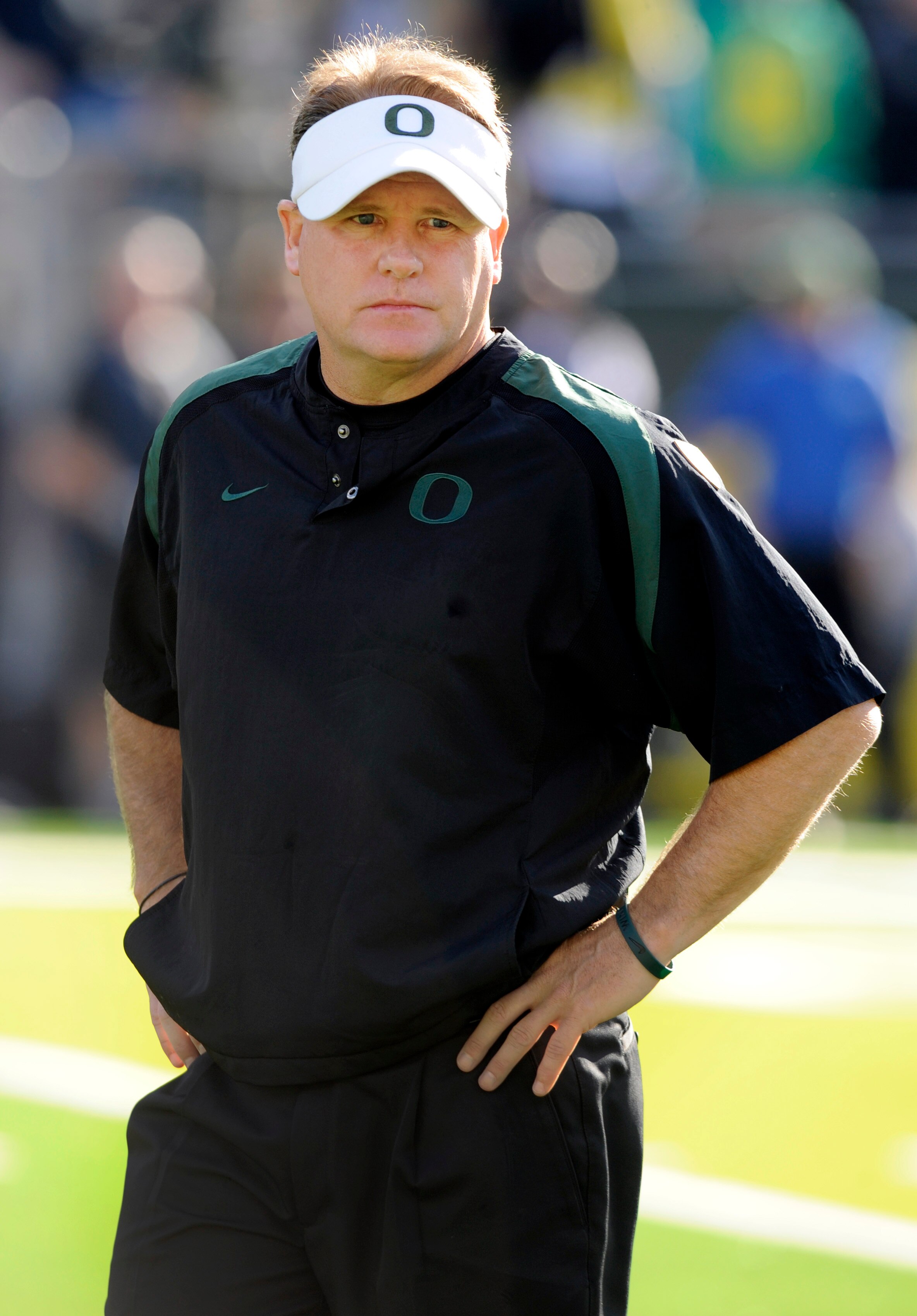 EUGENE, OR - OCTOBER 2: Head coach Chip Kelly of the Oregon Ducks looks looks on as his team warms up before the game against the Stanford Cardinal at Autzen Stadium on October 2, 2010 in Eugene, Oregon. Oregon won the game 52-31. (Photo by Steve Dykes/Ge