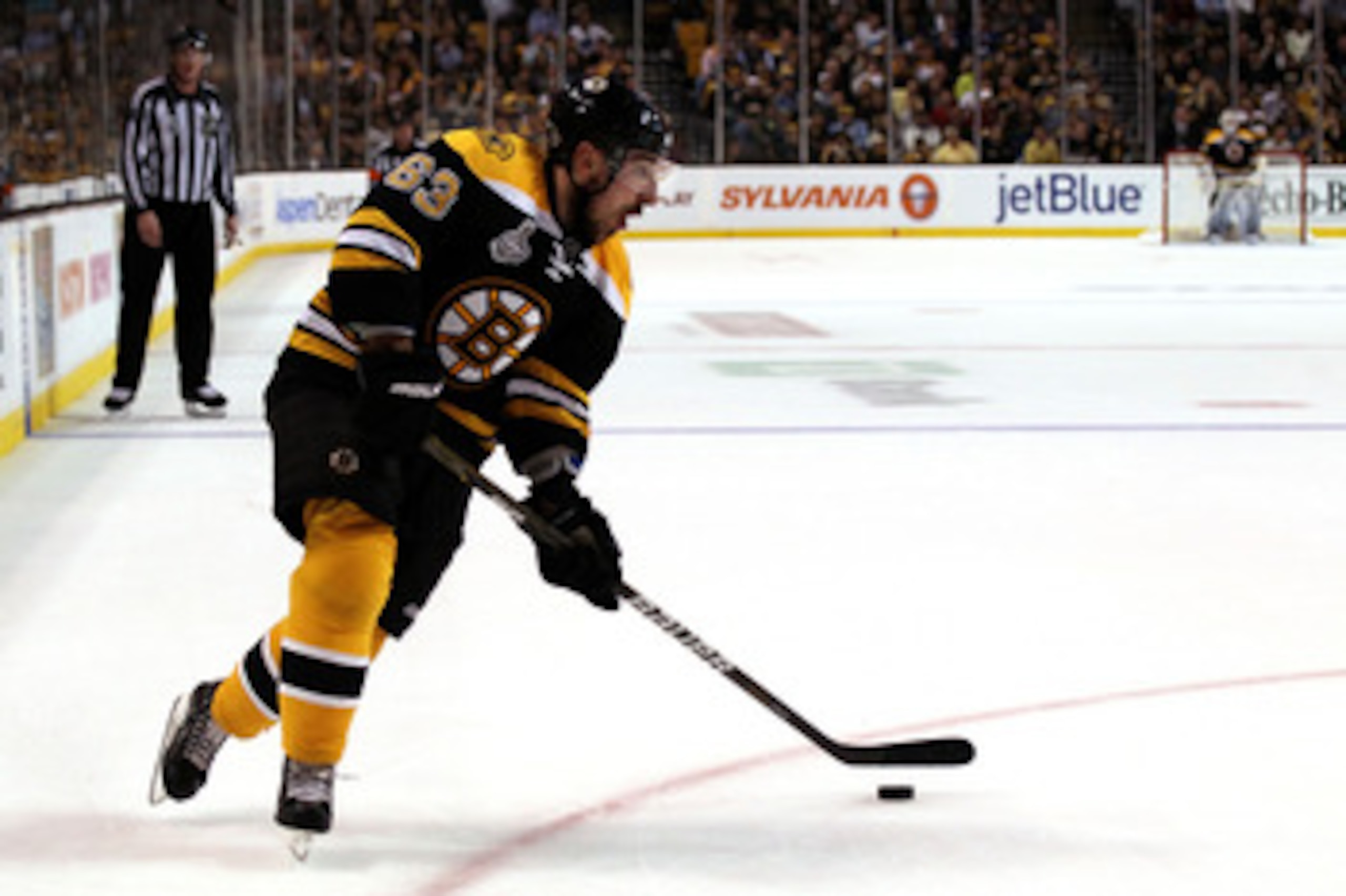 BOSTON, MA - JUNE 13:  Brad Marchand #63 of the Boston Bruins skates with the puck during Game Six of the 2011 NHL Stanley Cup Final at TD Garden on June 13, 2011 in Boston, Massachusetts.  (Photo by Elsa/Getty Images)