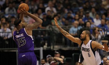 DALLAS, TX - FEBRUARY 16:  Forward DeMarcus Cousins #15 of the Sacramento Kings takes a shot against Tyson Chandler #6 of the Dallas Mavericks at American Airlines Center on February 16, 2011 in Dallas, Texas.  NOTE TO USER: User expressly acknowledges an