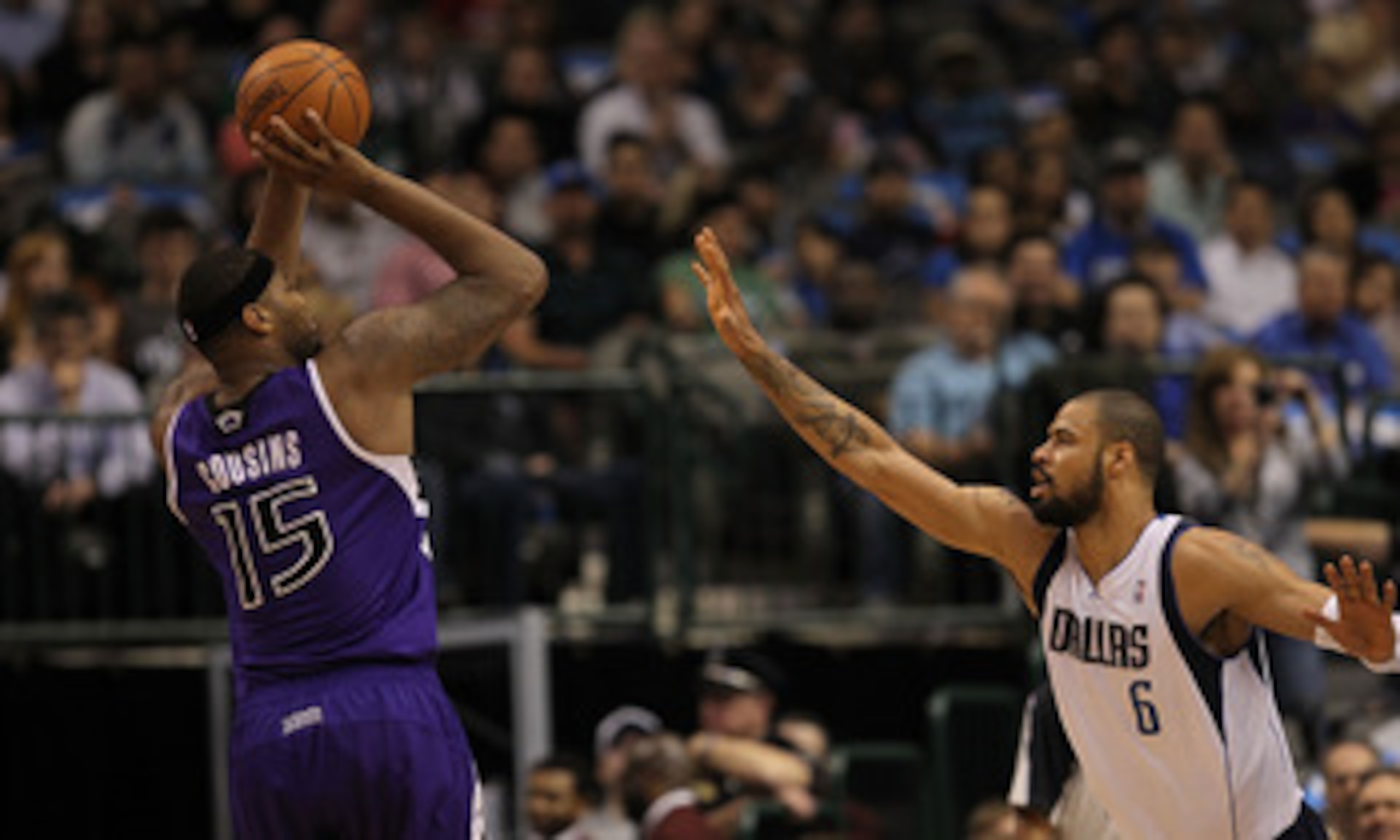 DALLAS, TX - FEBRUARY 16:  Forward DeMarcus Cousins #15 of the Sacramento Kings takes a shot against Tyson Chandler #6 of the Dallas Mavericks at American Airlines Center on February 16, 2011 in Dallas, Texas.  NOTE TO USER: User expressly acknowledges an