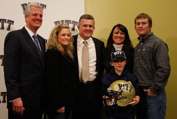 PITTSBURGH - JANUARY 11:  The new University of Pittsburgh head football coach, Todd Graham (center), poses for a photograph with members of his family and University of Pittsburgh athletic director, Steve Pederson (far left), during a press conference on
